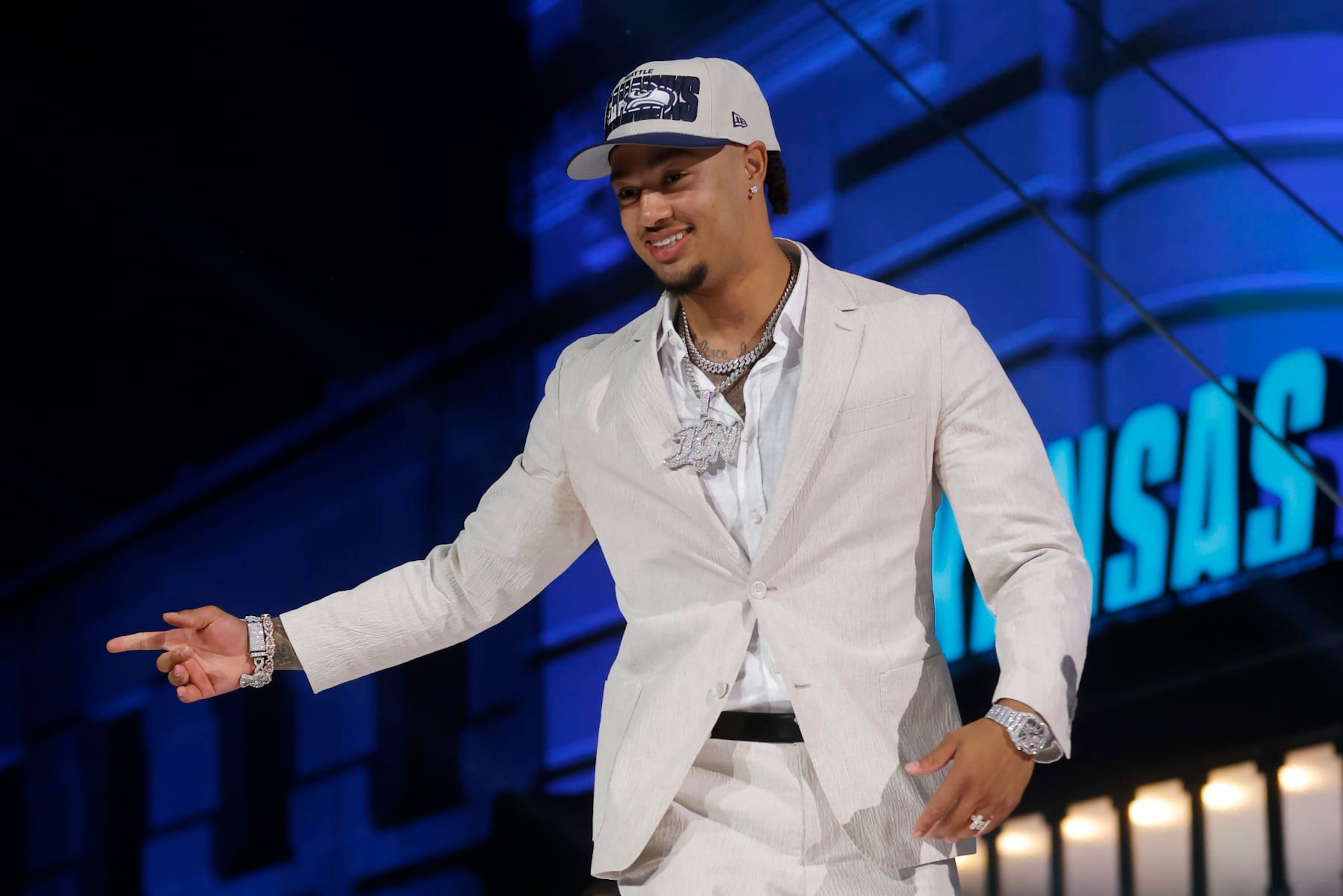 KANSAS CITY, MISSOURI - APRIL 27: Jaxon Smith-Njigba walks onstage after being selected 20th overall by the Seattle Seahawks during the first round of the 2023 NFL Draft at Union Station on April 27, 2023 in Kansas City, Missouri. (Photo by David Eulitt/Getty Images)