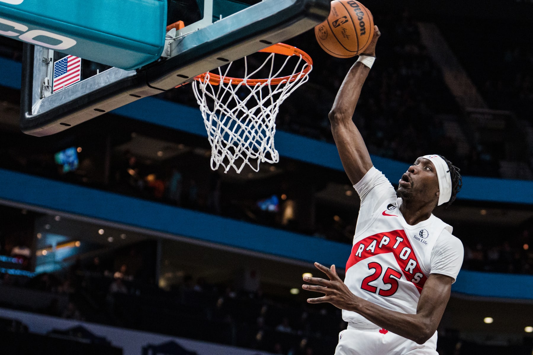 CHARLOTTE, NORTH CAROLINA - APRIL 02: Chris Boucher #25 of the Toronto Raptors dunks the ball against the Charlotte Hornets in the fourth quarter during their game at Spectrum Center on April 02, 2023 in Charlotte, North Carolina. NOTE TO USER: User expressly acknowledges and agrees that, by downloading and or using this photograph, User is consenting to the terms and conditions of the Getty Images License Agreement. (Photo by Jacob Kupferman/Getty Images)