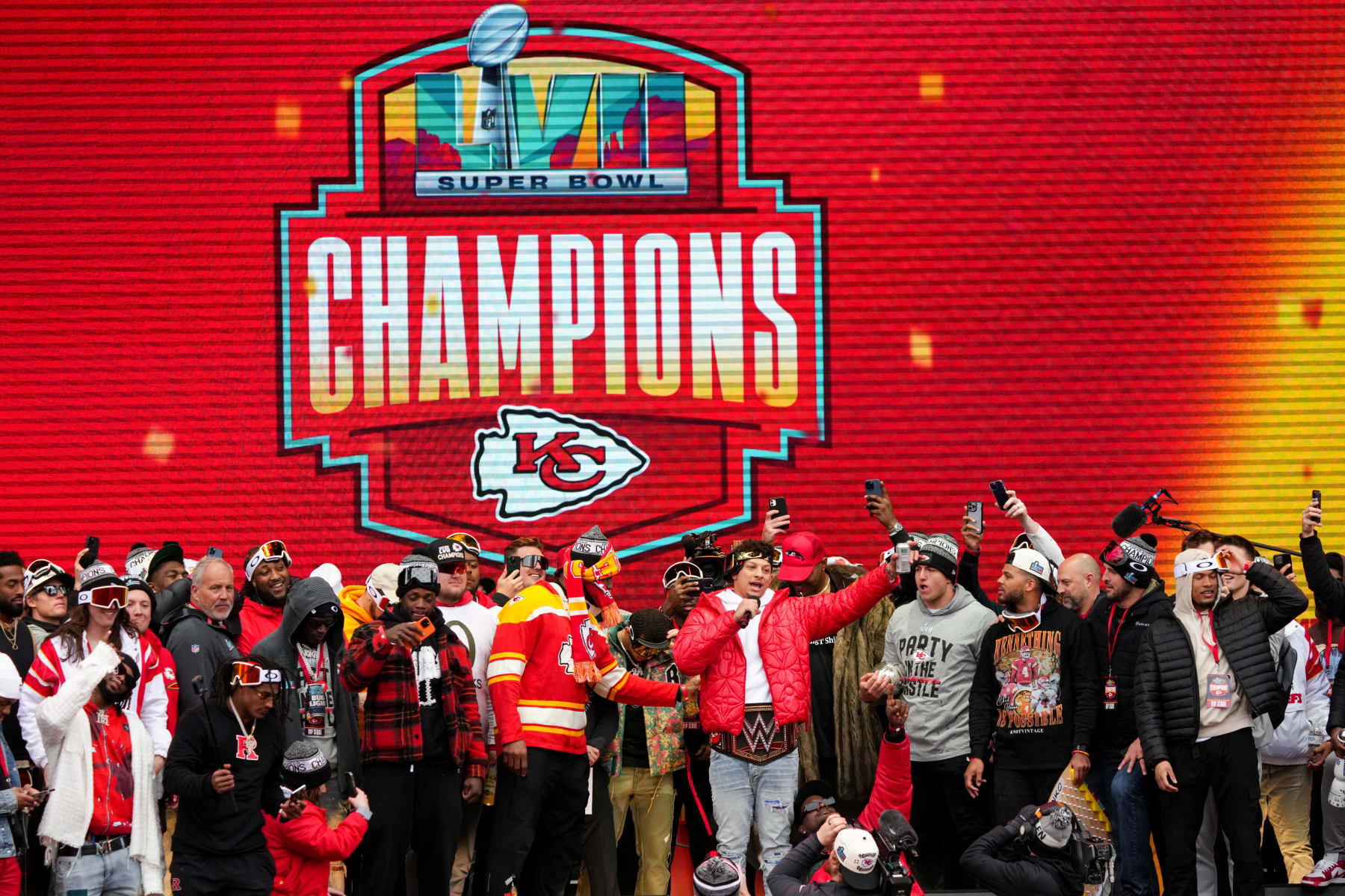 KANSAS CITY, MISSOURI - FEBRUARY 15: Patrick Mahomes #15 of the Kansas City Chiefs celebrates on stage with teammates during the Kansas City Chiefs Super Bowl LVII victory parade on February 15, 2023 in Kansas City, Missouri. (Photo by Jay Biggerstaff/Getty Images)