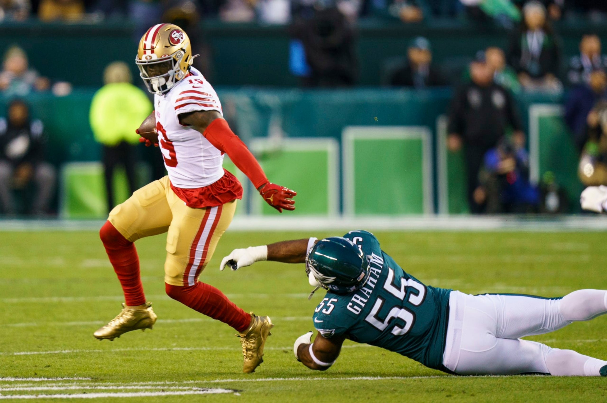 San Francisco 49ers wide receiver Deebo Samuel (19) in action against Philadelphia Eagles defensive end Brandon Graham (55) during the NFC Championship NFL football game, Sunday, Jan. 29, 2023, in Philadelphia. (AP Photo/Chris Szagola)