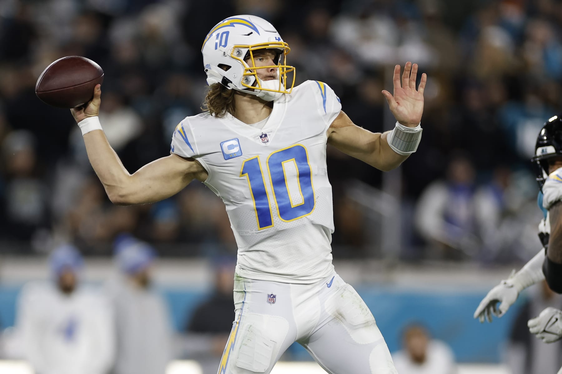 JACKSONVILLE, FL - JANUARY 14: Los Angeles Chargers quarterback Justin Herbert (10) throws a pass during the game between the Los Angeles Chargers and the Jacksonville Jaguars on January 14, 2023 at TIAA Bank Field in Jacksonville, Fl. (Photo by David Rosenblum/Icon Sportswire via Getty Images)