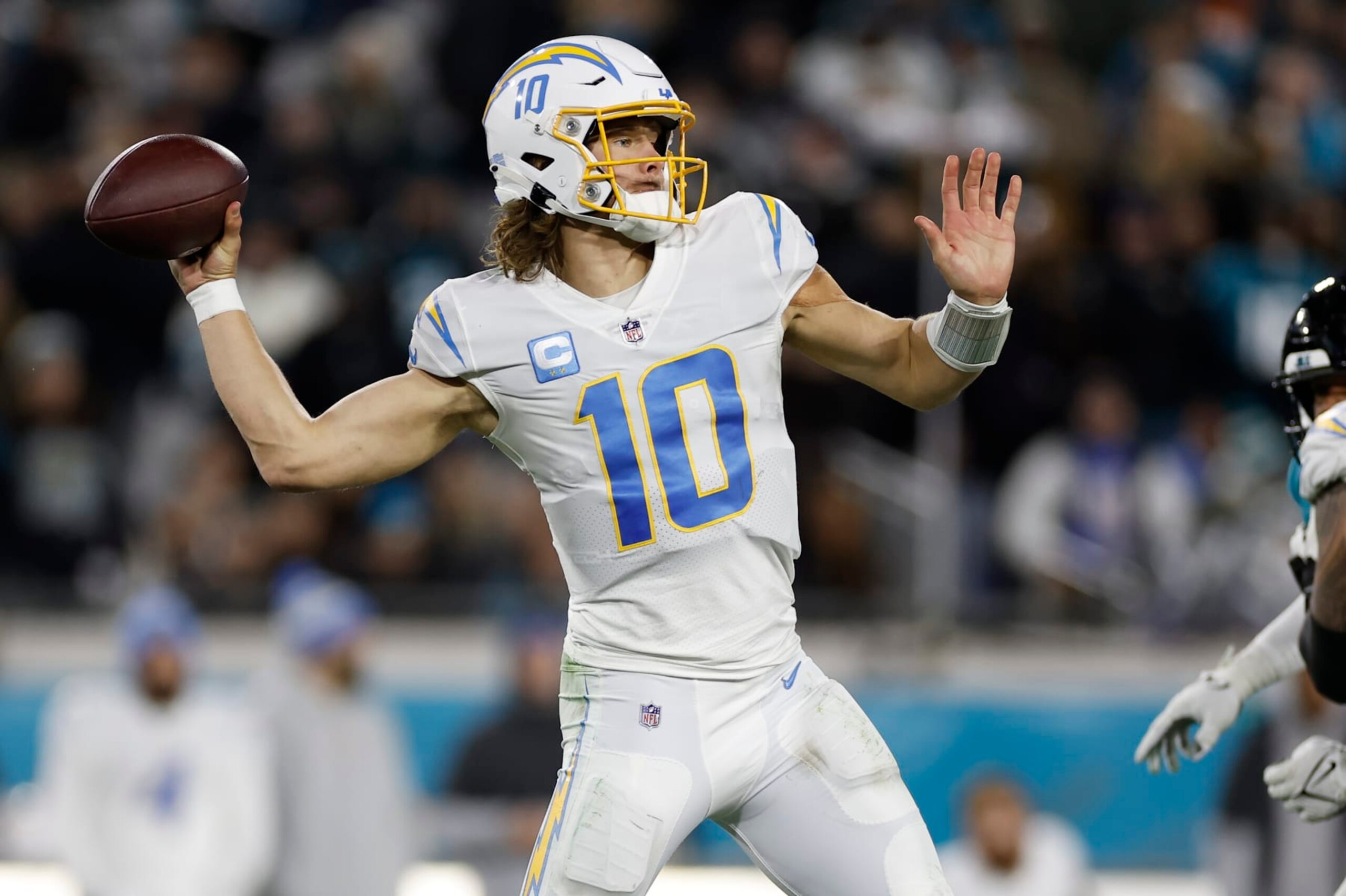 JACKSONVILLE, FL - JANUARY 14: Los Angeles Chargers quarterback Justin Herbert (10) throws a pass during the game between the Los Angeles Chargers and the Jacksonville Jaguars on January 14, 2023 at TIAA Bank Field in Jacksonville, Fl. (Photo by David Rosenblum/Icon Sportswire via Getty Images)