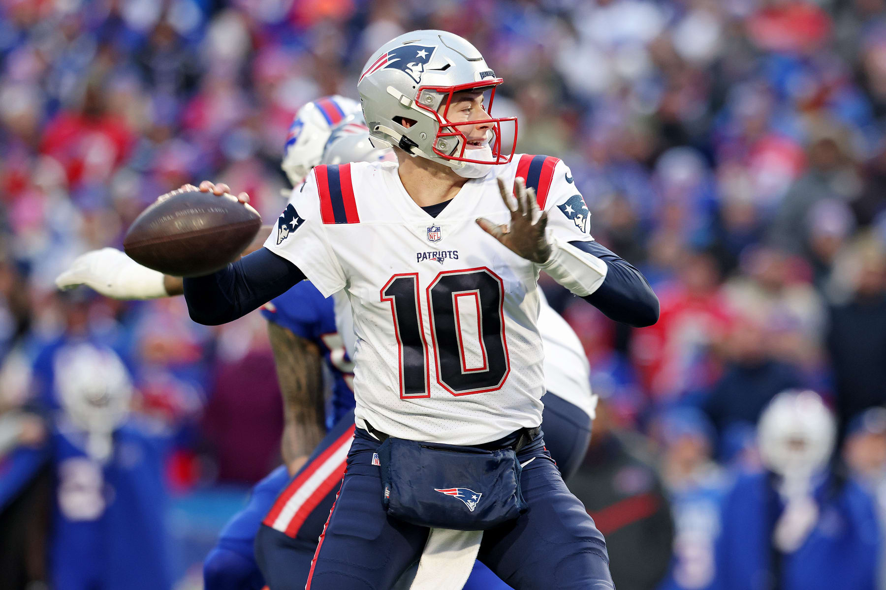 ORCHARD PARK, NEW YORK - JANUARY 08: Mac Jones #10 of the New England Patriots attempts a pass during the fourth quarter against the Buffalo Bills at Highmark Stadium on January 08, 2023 in Orchard Park, New York. (Photo by Bryan M. Bennett/Getty Images)