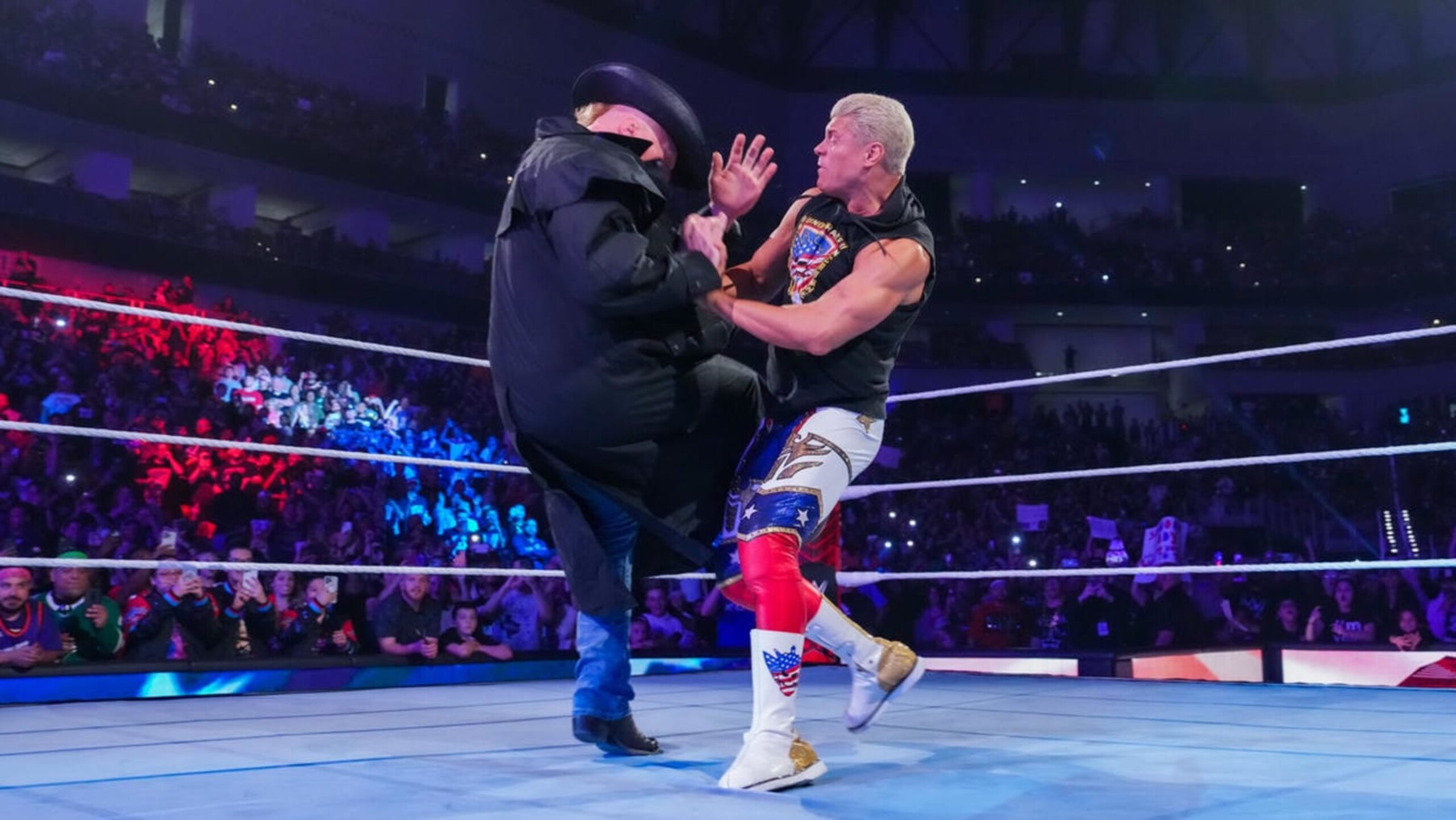 Cody Rhodes attacking Brock Lesnar.