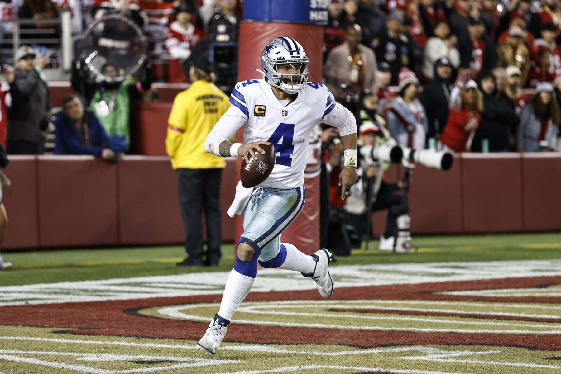 SANTA CLARA, CALIFORNIA - JANUARY 22: Dak Prescott #4 of the Dallas Cowboys scrambles and runs with the ball during an NFL divisional round playoff football game between the San Francisco 49ers and the Dallas Cowboys at Levi's Stadium on January 22, 2023 in Santa Clara, California. (Photo by Michael Owens/Getty Images)