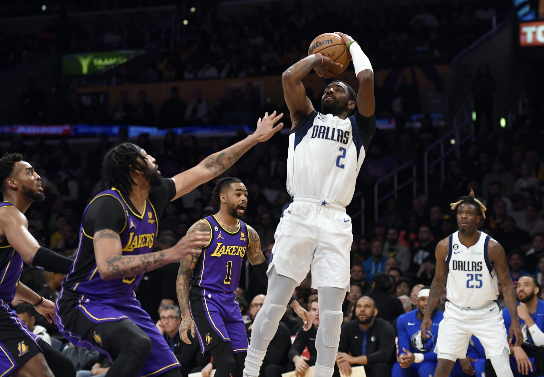 LOS ANGELES, CA - MARCH 17: Kyrie Irving #2 of the Dallas Mavericks goes up for  layup against Anthony Davis #3 of the Los Angeles Lakers during the first half at Crypto.com Arena on March 17, 2023 in Los Angeles, California. NOTE TO USER: User expressly acknowledges and agrees that, by downloading and or using this photograph, User is consenting to the terms and conditions of the Getty Images License Agreement.(Photo by Kevork Djansezian/Getty Images)