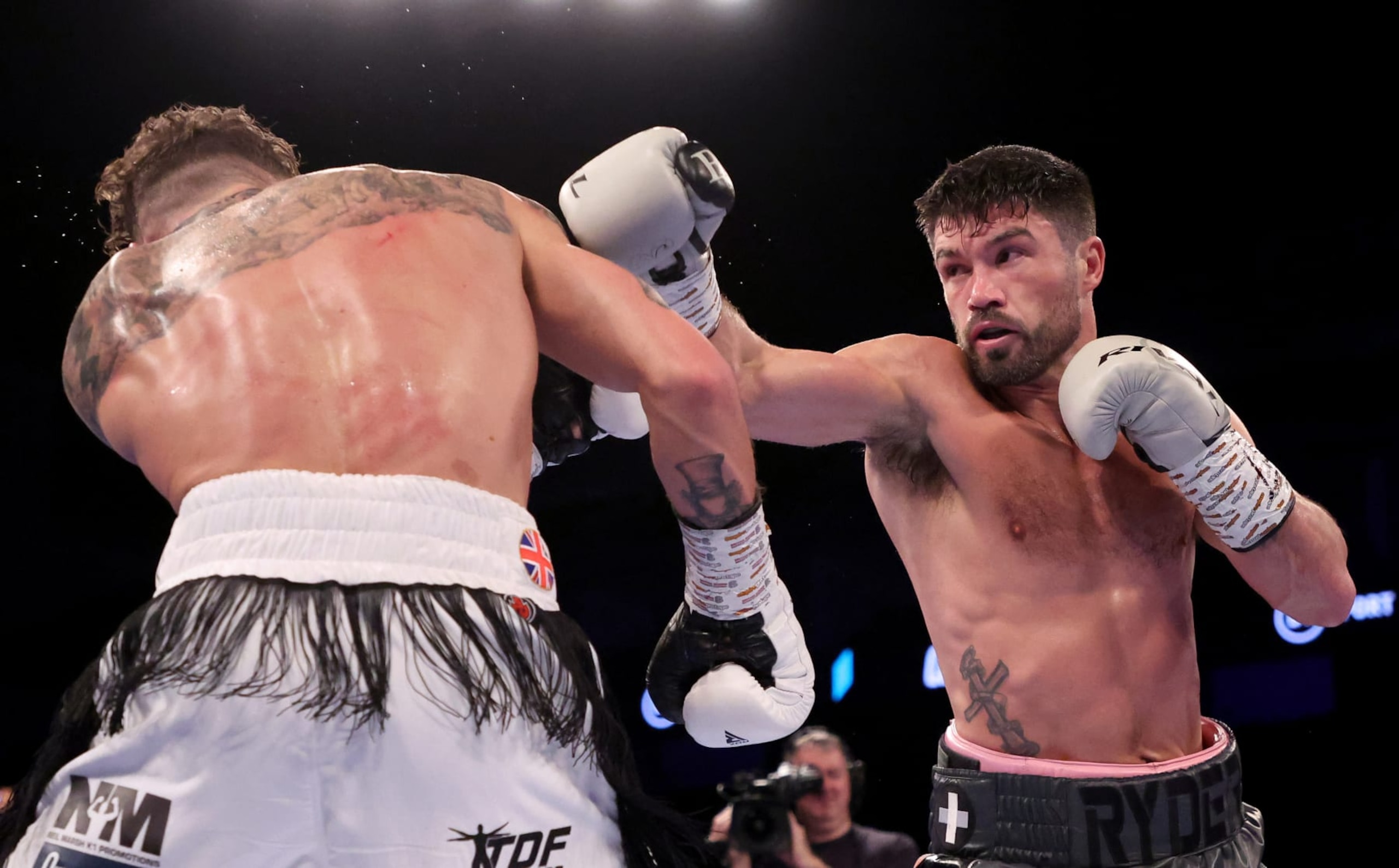 John Ryder throws a punch at Zach Parker. 