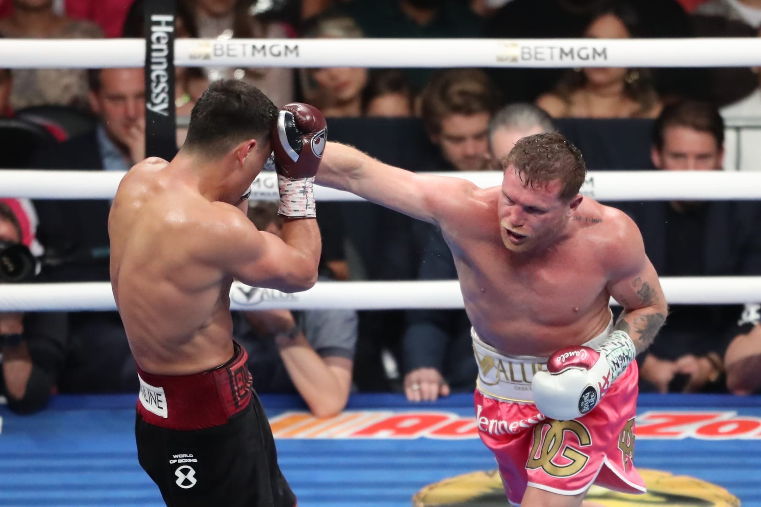 Canelo Alvarez swings at Dmitry Bivol in their May 2022 fight. 