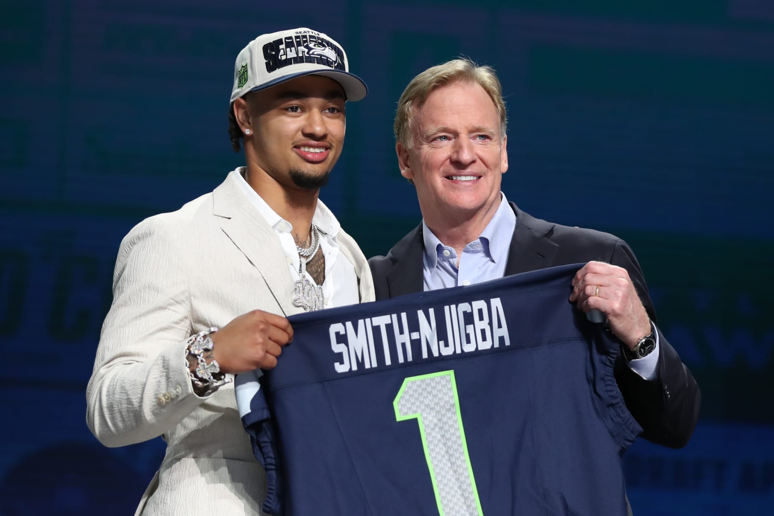 KANSAS CITY, MO - APRIL 27: Ohio State wide receiver Jaxon Smith-Njigba holds a jersey with commission Roger Goodell after being drafted in the first round of the NFL Draft on April 27, 2023 at Union Station in Kansas City, MO. (Photo by Scott Winters/Icon Sportswire via Getty Images) KANSAS CITY, MO - APRIL 27: Ohio State wide receiver Jaxon Smith-Njigba holds a jersey with commission Roger Goodell after being drafted in the first round of the NFL Draft on April 27, 2023 at Union Station in Kansas City, MO. (Photo by Scott Winters/Icon Sportswire via Getty Images)