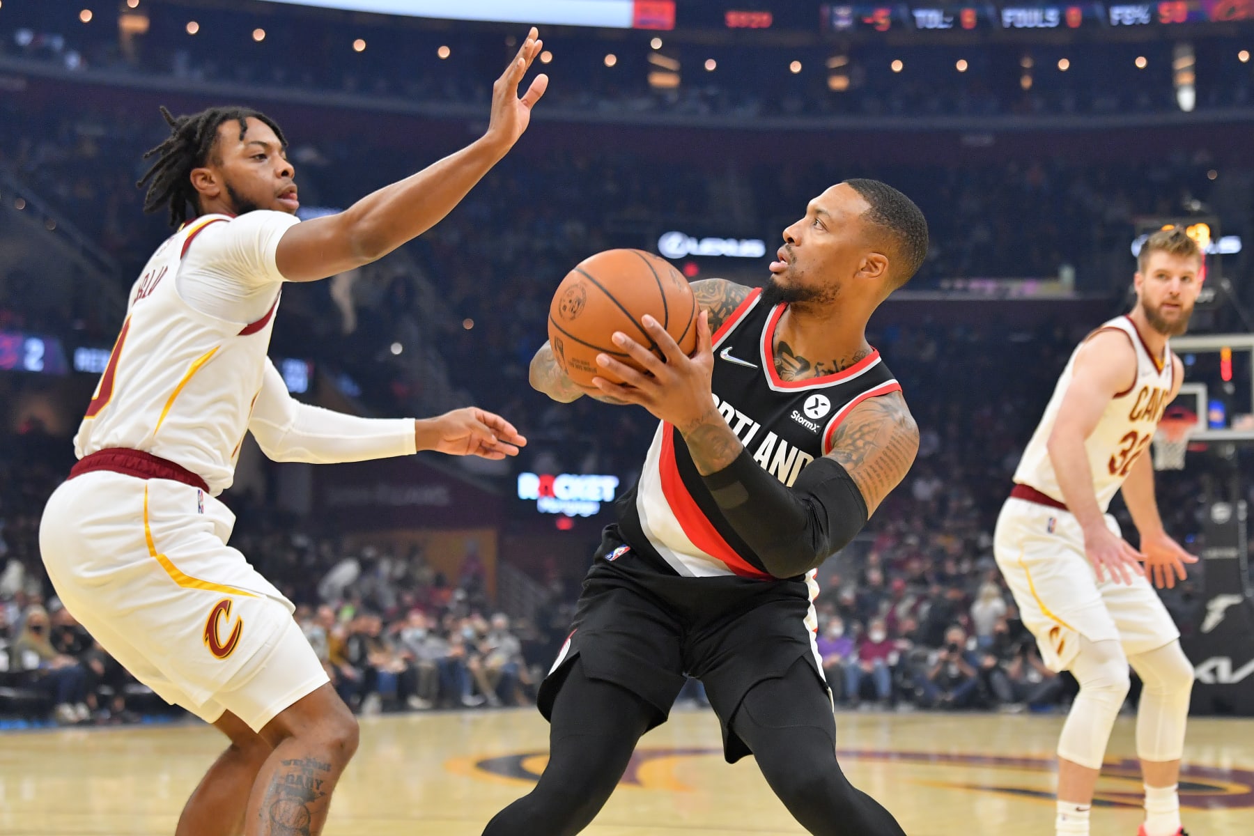 CLEVELAND, OHIO - NOVEMBER 03: Damian Lillard #0 of the Portland Trail Blazers shoots over Darius Garland #10 of the Cleveland Cavaliers during the first half at Rocket Mortgage Fieldhouse on November 03, 2021 in Cleveland, Ohio. NOTE TO USER: User expressly acknowledges and agrees that, by downloading and/or using this photograph, user is consenting to the terms and conditions of the Getty Images License Agreement. (Photo by Jason Miller/Getty Images)