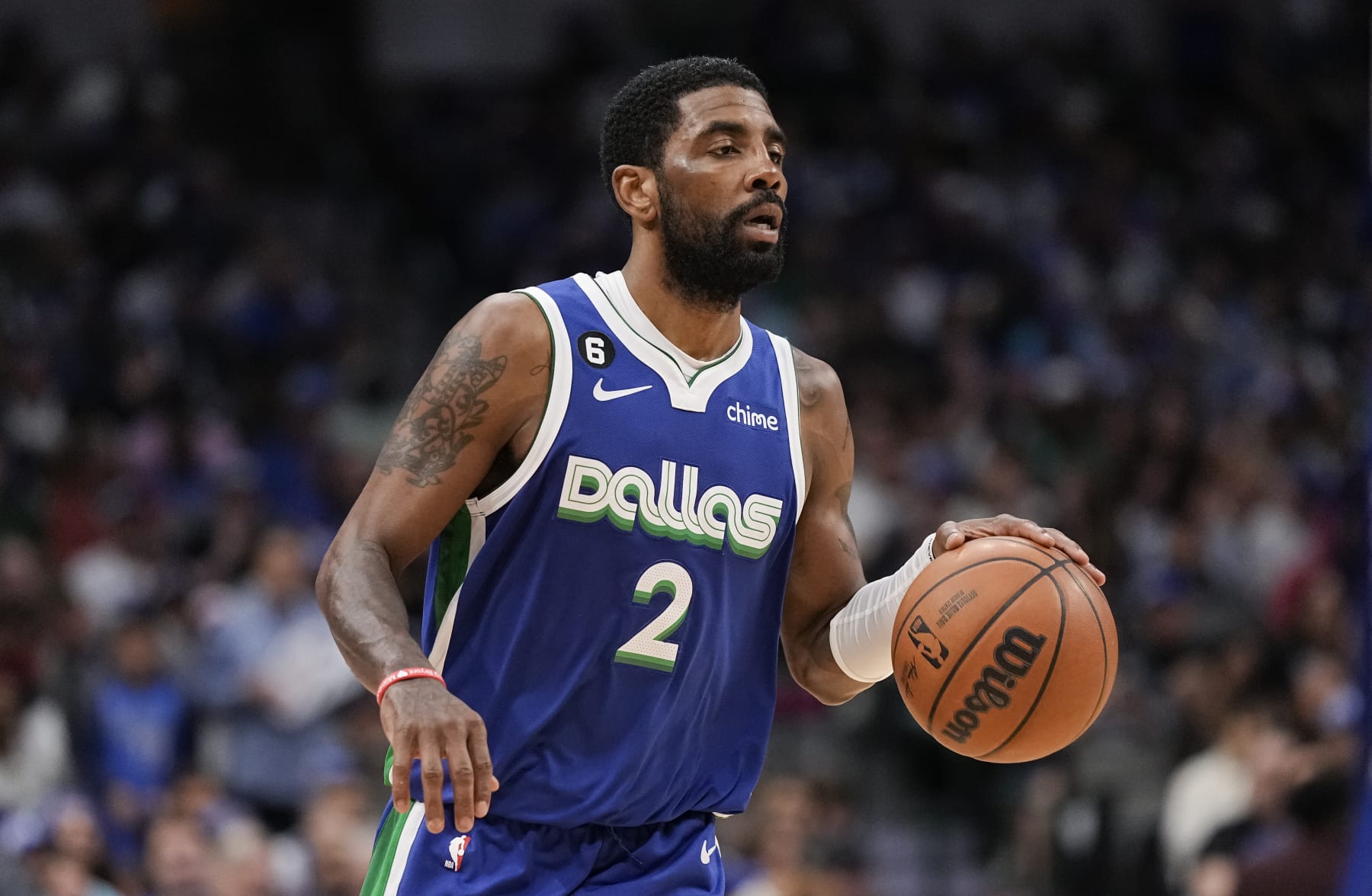 Dallas Mavericks guard Kyrie Irving (2) brings the ball up court during the second half of an NBA basketball game against the Sacramento Kings in Dallas, Wednesday, April 5, 2023. (AP Photo/Sam Hodde)