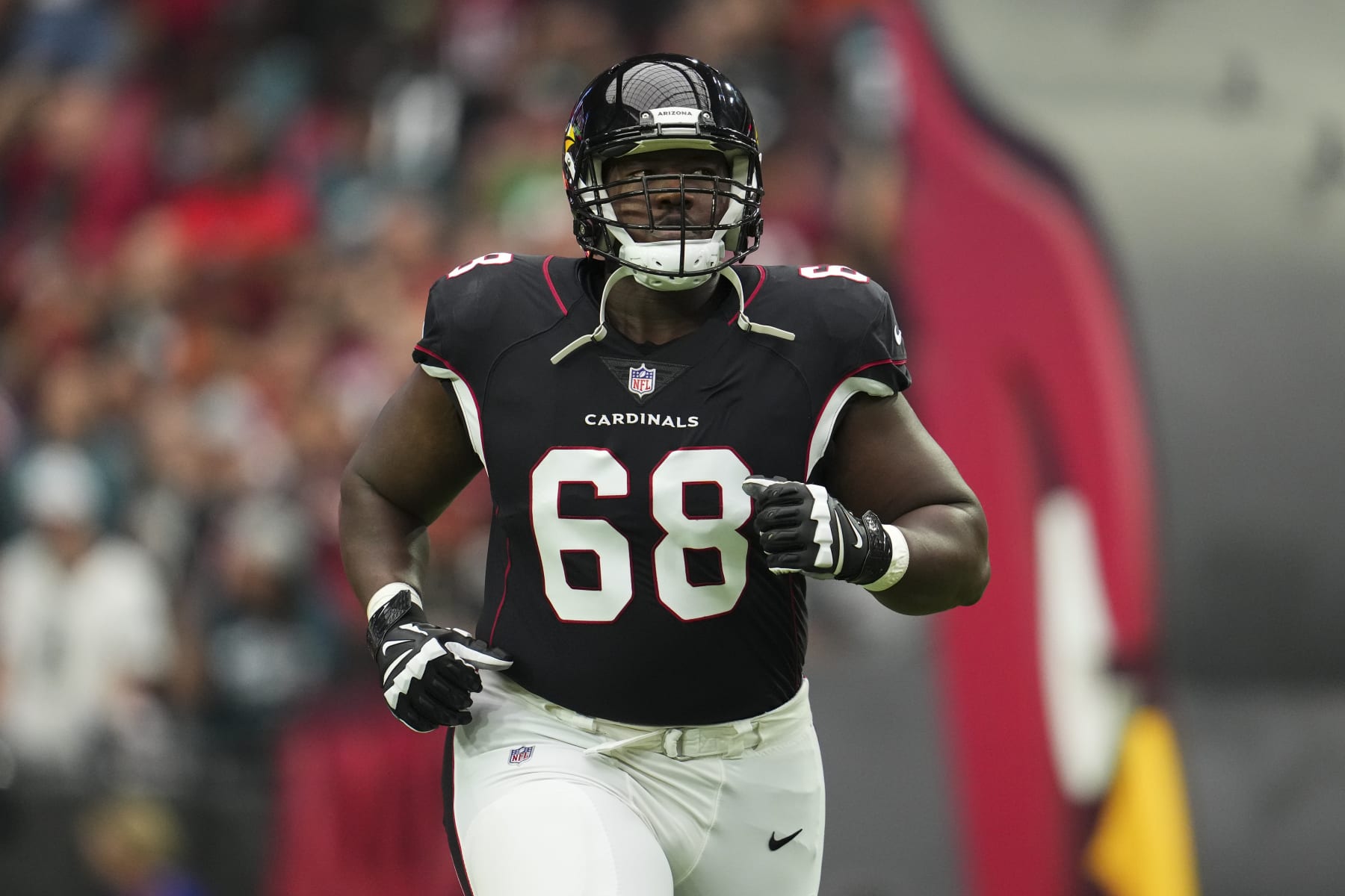 GLENDALE, AZ - OCTOBER 09: Kelvin Beachum #68 of the Arizona Cardinals runs out during introductions against the Philadelphia Eagles at State Farm Stadium on October 9, 2022 in Glendale, Arizona. (Photo by Cooper Neill/Getty Images)