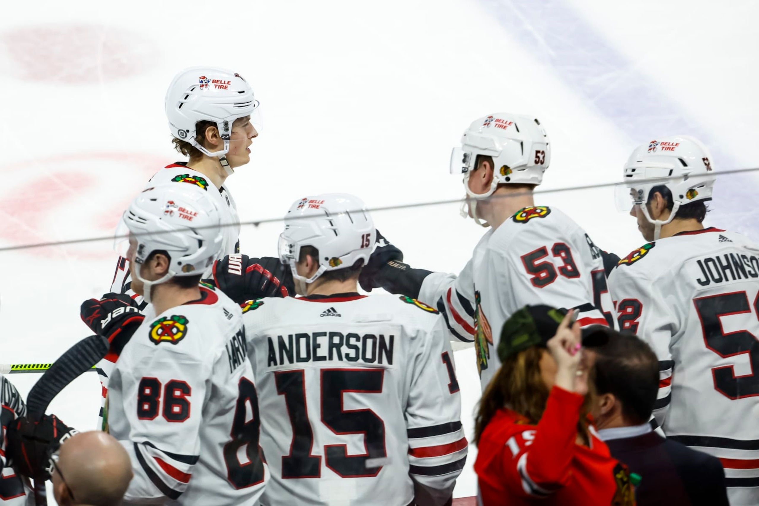 ST PAUL, MN - MARCH 25: Lukas Reichel #27 of the Chicago Blackhawks celebrates his goal against the Minnesota Wild with teammates on the bench in the third period of the game at Xcel Energy Center on March 25, 2023 in St Paul, Minnesota. The Wild defeated the Blackhawks 3-1. (Photo by David Berding/Getty Images)