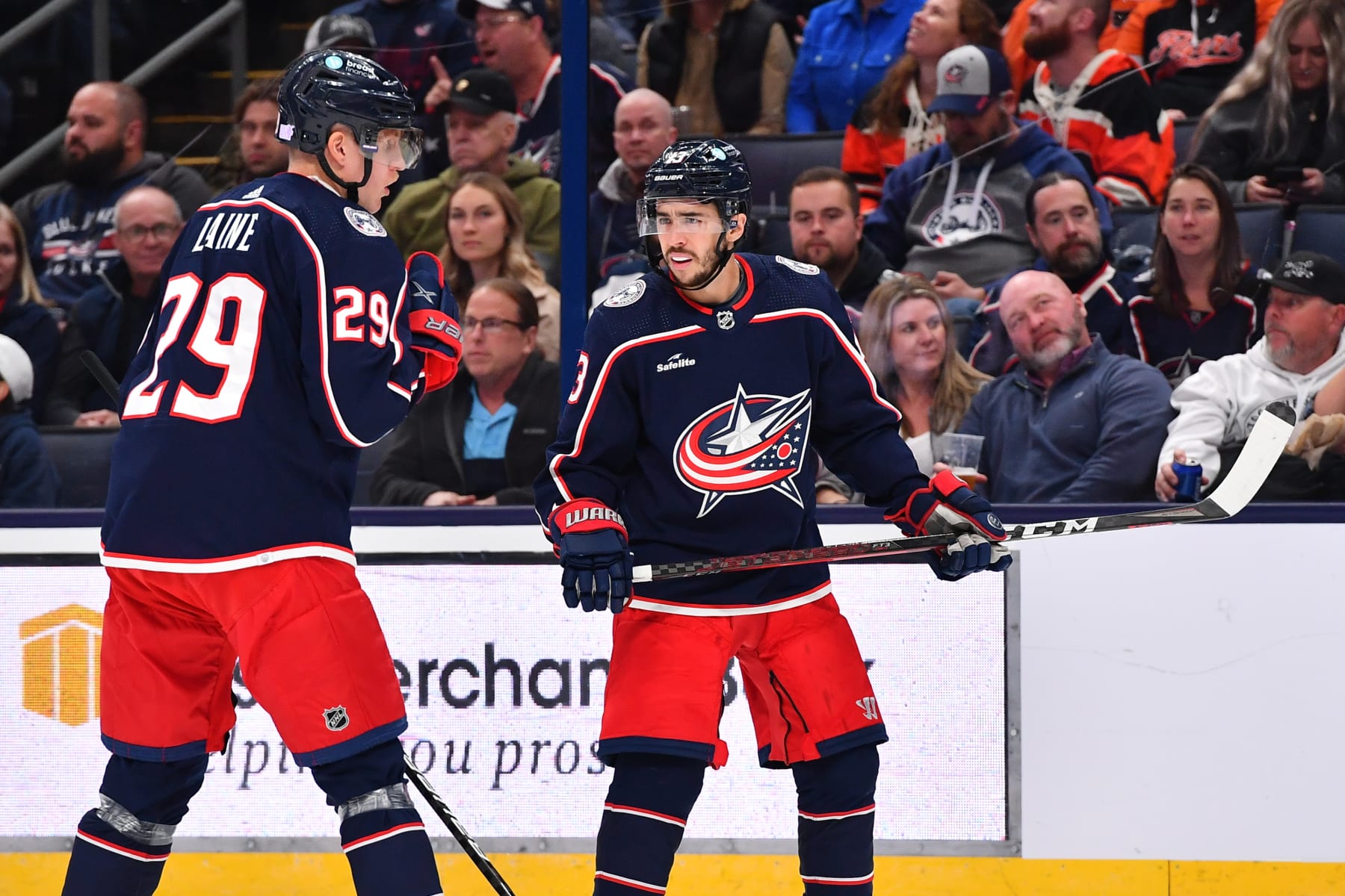 COLUMBUS, OHIO - NOVEMBER 10: Johnny Gaudreau #13 of the Columbus Blue Jackets talks with teammate Patrik Laine #29 of the Columbus Blue Jackets during the first period of a game against the Philadelphia Flyers at Nationwide Arena on November 10, 2022 in Columbus, Ohio. (Photo by Ben Jackson/NHLI via Getty Images)