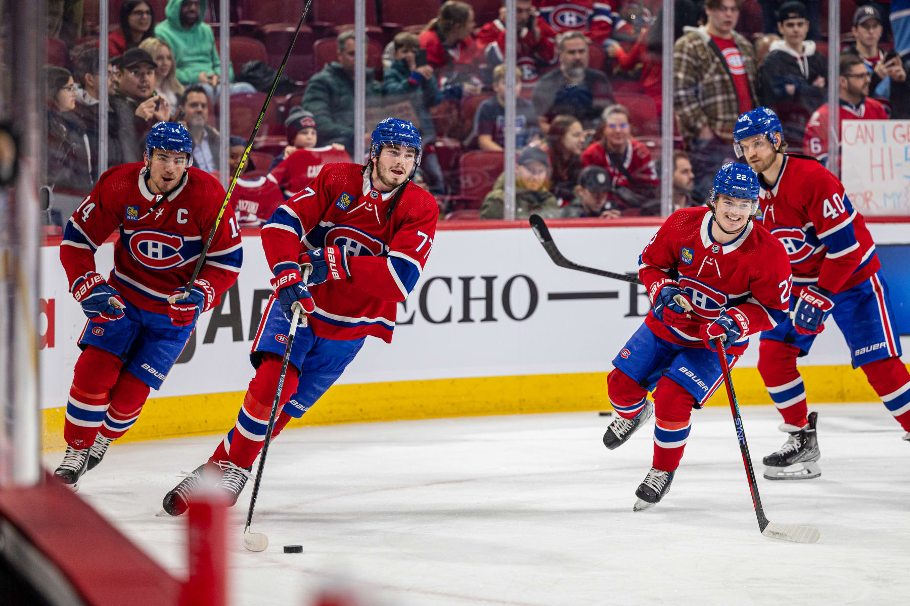 MONTREAL, CANADA - JANUARY 5: Nick Suzuki #14, Kirby Dach #77 and Cole Caufield #22 of the Montreal Canadiens skate during the warm-up of the NHL regular season game between the Montreal Canadiens and the New York Rangers at the Bell Centre on January 5, 2023 in Montreal, Quebec, Canada. (Photo by Vitor Munhoz/NHLI via Getty Images)