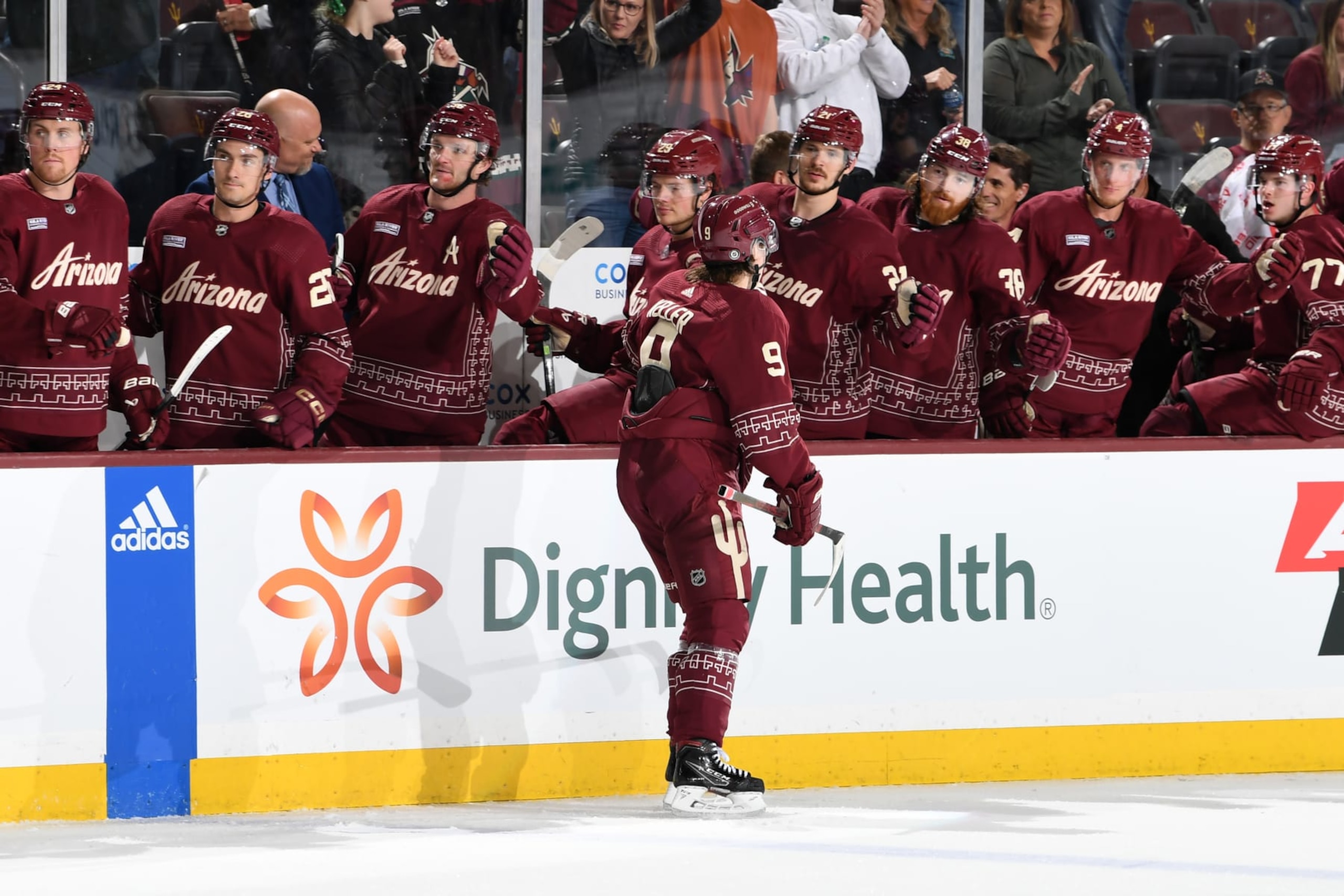 TEMPE, ARIZONA - APRIL 08: Clayton Keller #9 of the Arizona Coyotes celebrates with teammates on the bench after scoring a goal against the Anaheim Ducks during the second period at Mullett Arena on April 08, 2023 in Tempe, Arizona. (Photo by Norm Hall/NHLI via Getty Images)