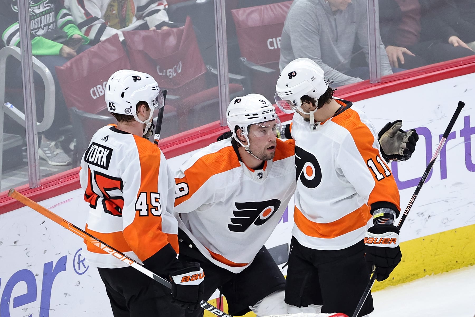 CHICAGO, ILLINOIS - APRIL 13: Ivan Provorov #9 of the Philadelphia Flyers is congratulated by Travis Konecny #11 and Cam York #45 following a goal against the Chicago Blackhawks in overtime at United Center on April 13, 2023 in Chicago, Illinois. The Flyers defeated the Blackhawks 5-4 in overtime. (Photo by Stacy Revere/Getty Images)