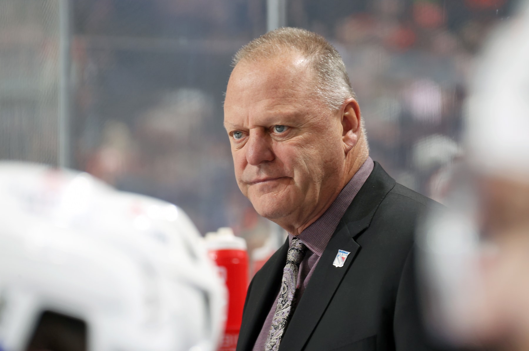 PHILADELPHIA, PENNSYLVANIA - DECEMBER 17:  Head Coach of the New York Rangers Gerard Gallant watches the play on the ice during the first period against the Philadelphia Flyers at the Wells Fargo Center on December 17, 2022 in Philadelphia, Pennsylvania.  (Photo by Len Redkoles/NHLI via Getty Images)
