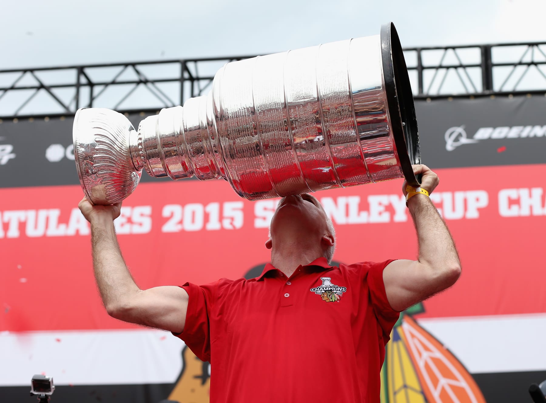 CHICAGO, IL - JUNE 18: Head coach Joel Quenneville of the Chicago Blackhawks kisses the Stanley Cup trophy during the Chicago Blackhawks Stanley Cup Championship Rally at Soldier Field on June 18, 2015 in Chicago, Illinois. (Photo by Jonathan Daniel/Getty Images)