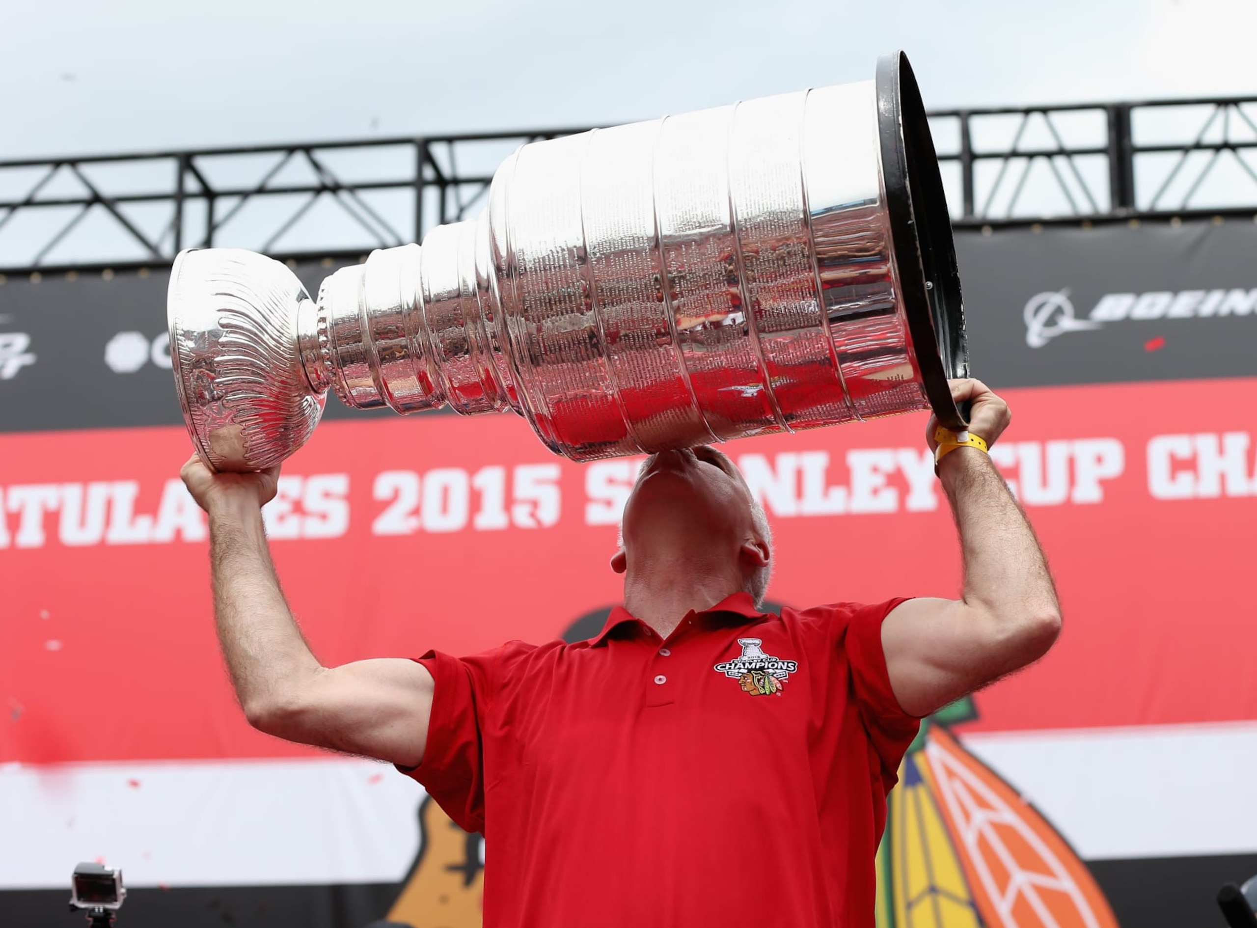 CHICAGO, IL - JUNE 18: Head coach Joel Quenneville of the Chicago Blackhawks kisses the Stanley Cup trophy during the Chicago Blackhawks Stanley Cup Championship Rally at Soldier Field on June 18, 2015 in Chicago, Illinois. (Photo by Jonathan Daniel/Getty Images)