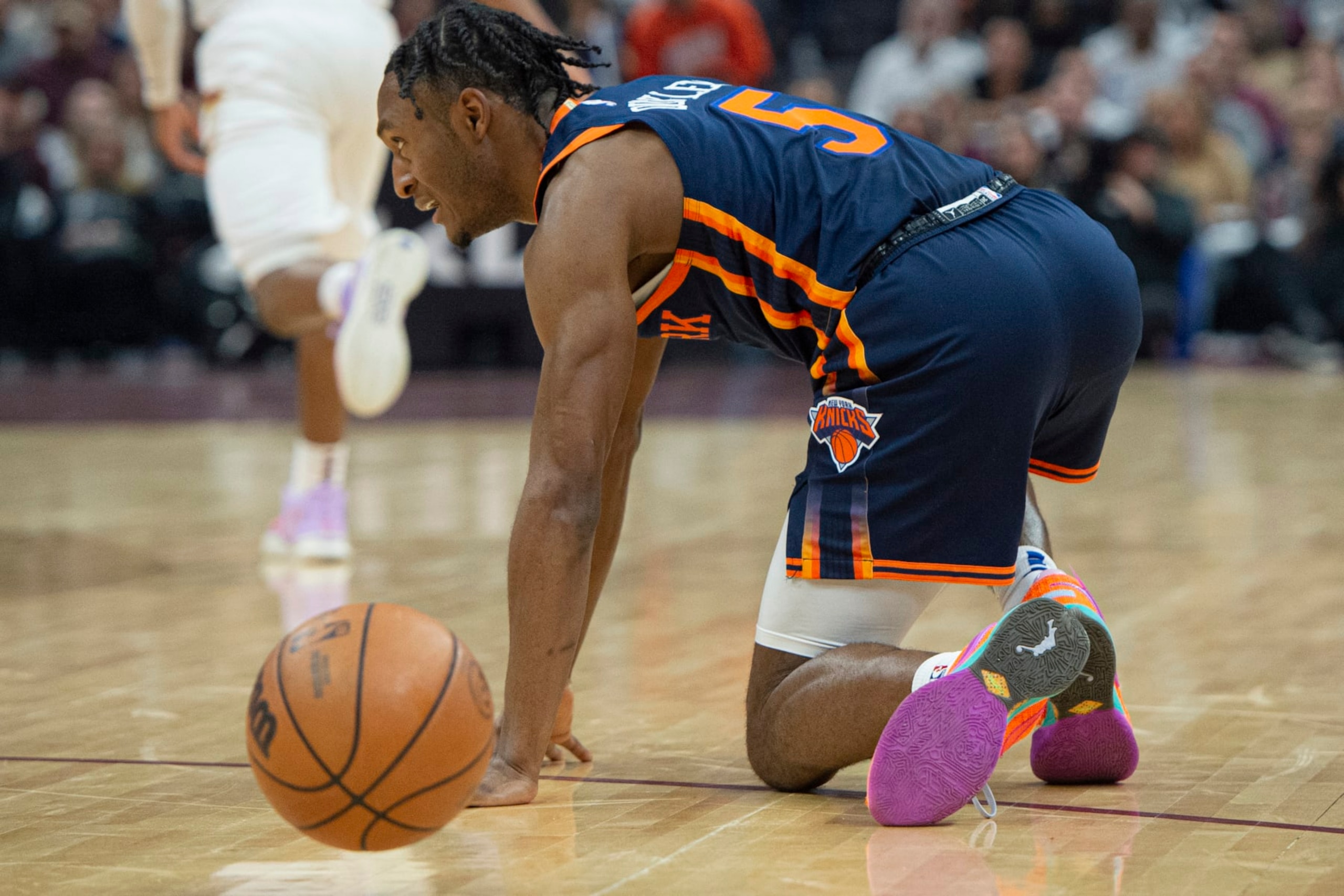 New York Knicks' Immanuel Quickley (5) gets off the court after being fouled against the Cleveland Cavaliers during the first half of Game 5 of an NBA basketball first-round playoff series, Wednesday, April 26, 2023, in Cleveland. (AP Photo/Phil Long)