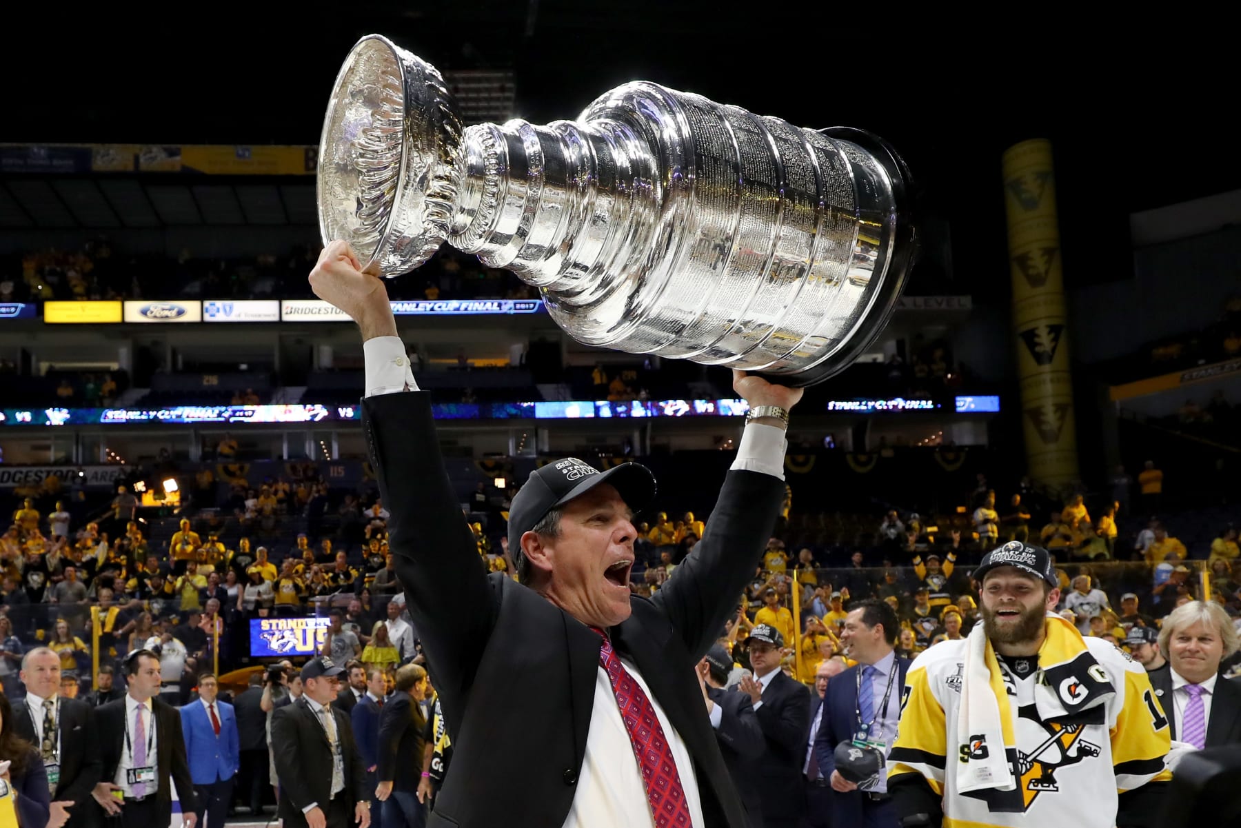NASHVILLE, TN - JUNE 11:  Head coach Mike Sullivan of the Pittsburgh Penguins celebrates with the Stanley Cup Trophy after defeating the Nashville Predators 2-0 in Game Six of the 2017 NHL Stanley Cup Final at the Bridgestone Arena on June 11, 2017 in Nashville, Tennessee.  (Photo by Bruce Bennett/Getty Images)
