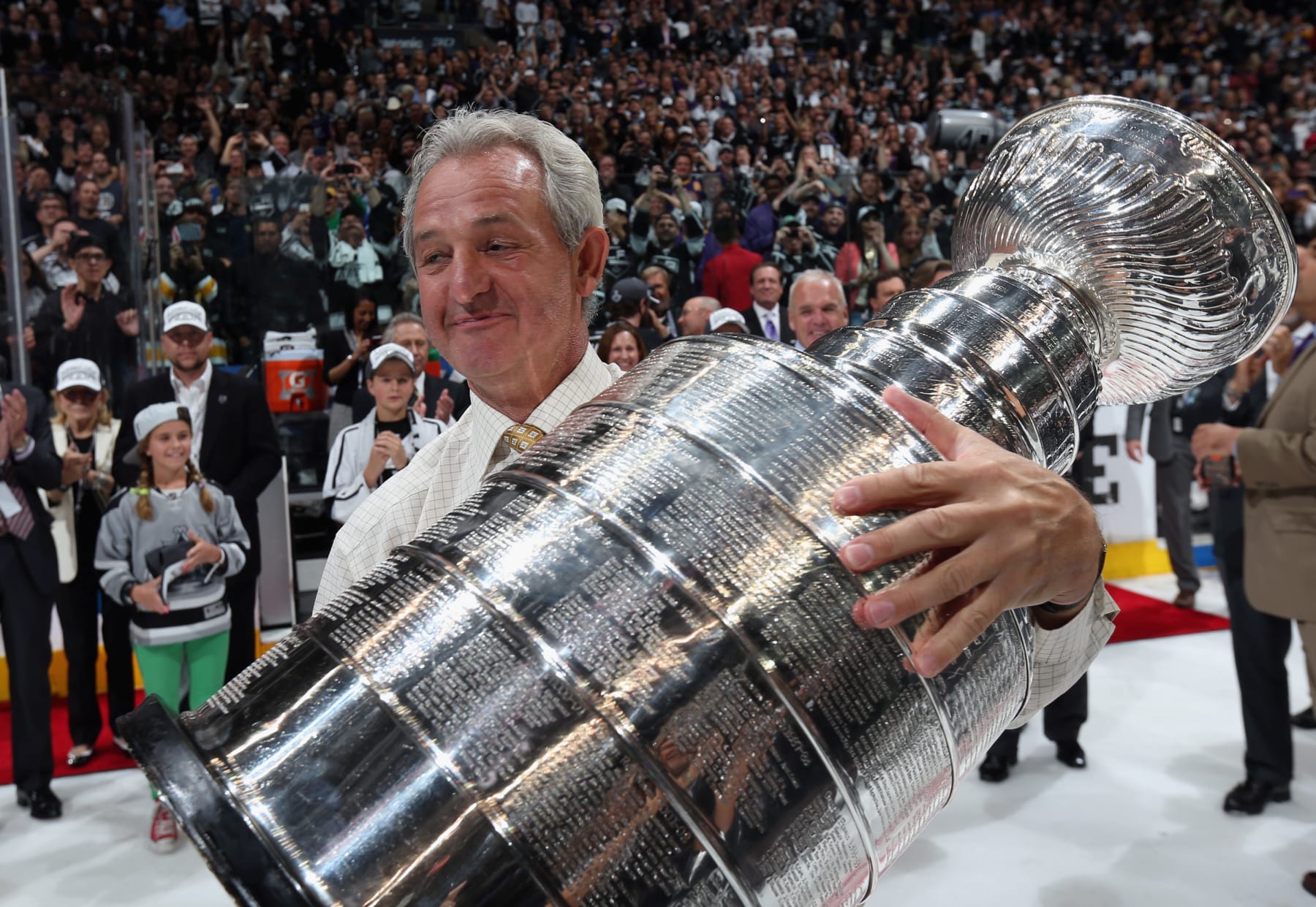 LOS ANGELES, CA - JUNE 13:  Head coach Darryl Sutter of the Los Angeles Kings holds the Stanley Cup after his team won Game Five 3-2 in double overtime over the New York Rangers in Game Five of the 2014 Stanley Cup Final at the Staples Center on June 13, 2014 in Los Angeles, California. The Kings won the game 3-2 and win the series 4-1.  (Photo by Dave Sandford/NHLI via Getty Images)