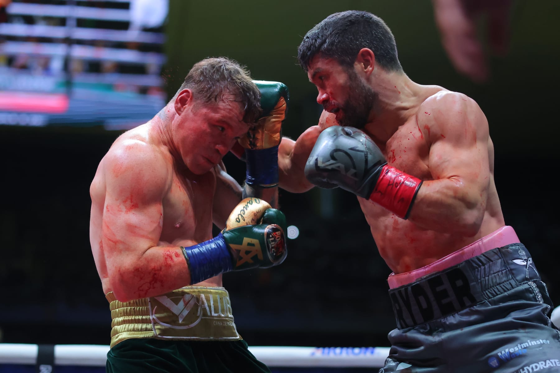 ZAPOPAN, MEXICO - MAY 06: John Ryder of Great Britain punches Canelo Alvarez of Mexico during the fight for the Super Middleweight Championship at Akron Stadium on May 06, 2023 in Zapopan, Mexico. (Photo by Hector Vivas/Getty Images)
