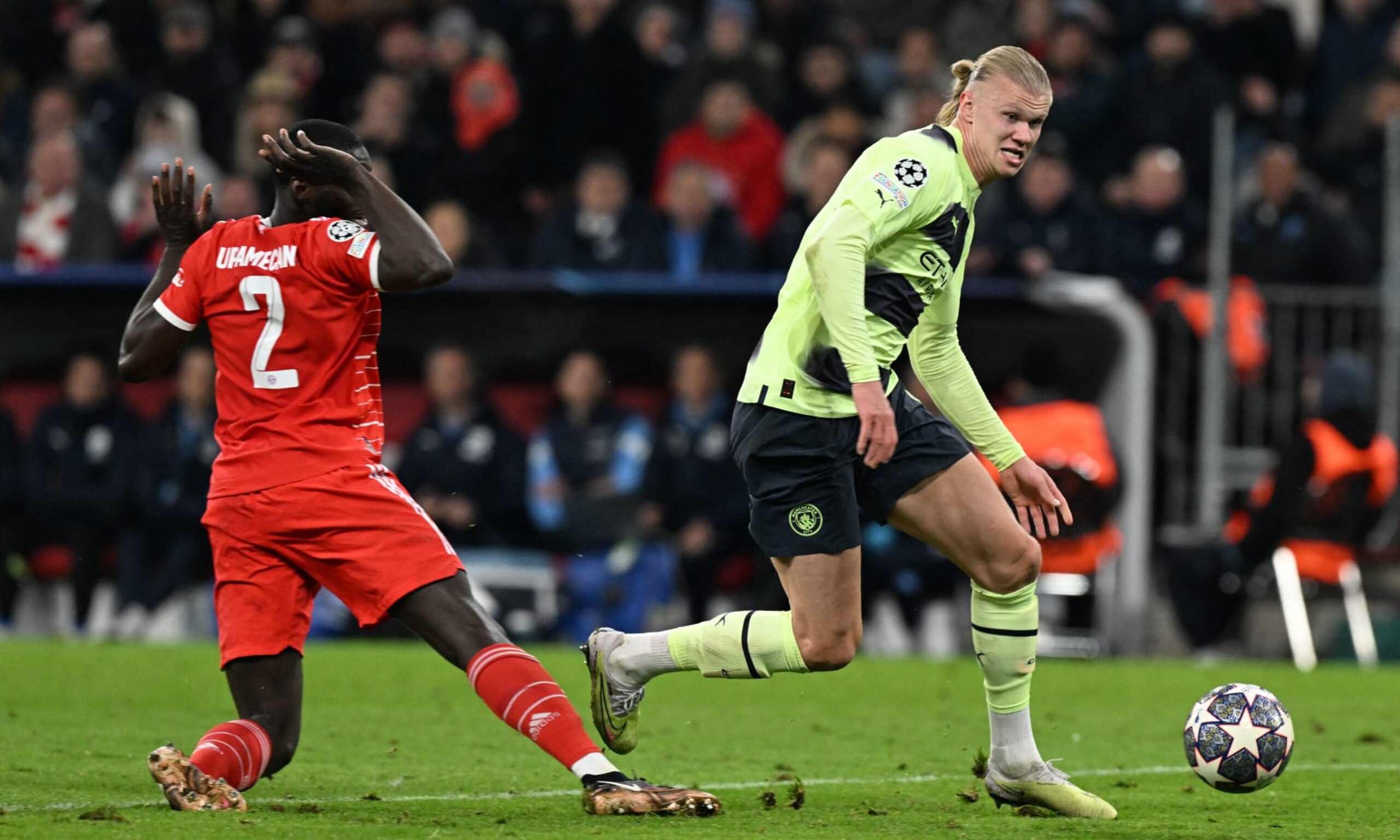 Manchester City's Norwegian striker Erling Haaland (R) runs past Bayern Munich's French defender Dayot Upamecano and towards the goal as he prepares to score the 0-1 opening goal during the UEFA Champions League quarter-final, second leg football match between Bayern Munich and Manchester City in Munich, southern Germany on April 19, 2023. (Photo by CHRISTOF STACHE / AFP) (Photo by CHRISTOF STACHE/AFP via Getty Images) Manchester City's Norwegian striker Erling Haaland (R) runs past Bayern Munich's French defender Dayot Upamecano and towards the goal as he prepares to score the 0-1 opening goal during the UEFA Champions League quarter-final, second leg football match between Bayern Munich and Manchester City in Munich, southern Germany on April 19, 2023. (Photo by CHRISTOF STACHE / AFP) (Photo by CHRISTOF STACHE/AFP via Getty Images)