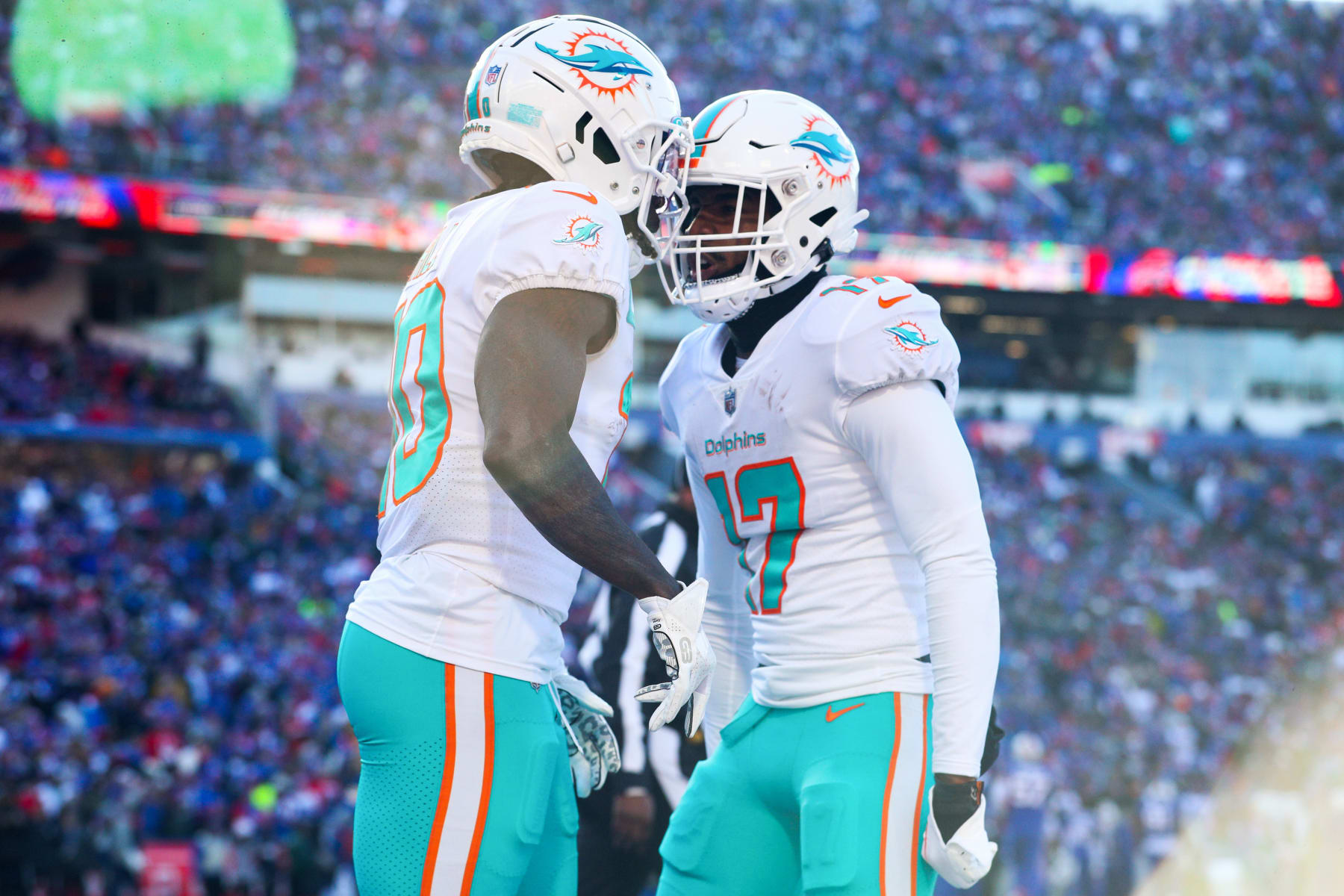 ORCHARD PARK, NEW YORK - JANUARY 15: Tyreek Hill #10 of the Miami Dolphins celebrates his successful two point conversion with teammate Jaylen Waddle #17 during the second quarter against the Buffalo Bills in the AFC Wild Card playoff game at Highmark Stadium on January 15, 2023 in Orchard Park, New York. (Photo by Bryan M. Bennett/Getty Images)