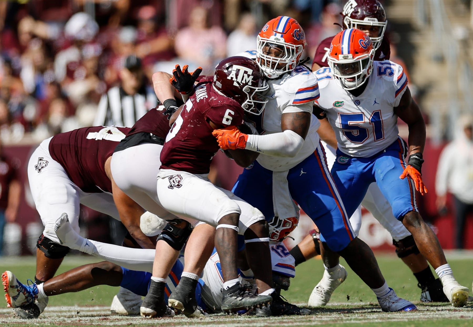 COLLEGE STATION, TEXAS - NOVEMBER 05: Gervon Dexter Sr. #9 of the Florida Gators tackles Devon Achane #6 of the Texas A&M Aggies for a loss in the second half at Kyle Field on November 05, 2022 in College Station, Texas. (Photo by Tim Warner/Getty Images)