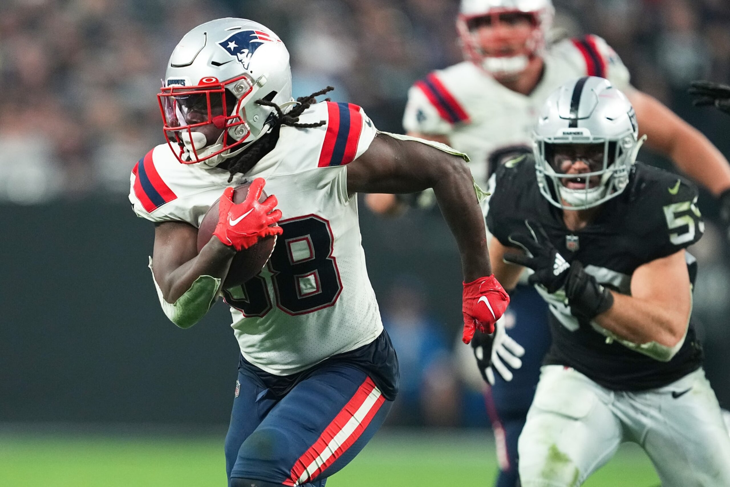 LAS VEGAS, NEVADA - DECEMBER 18: Rhamondre Stevenson #38 of the New England Patriots rushes for a touchdown during the fourth quarter against the Las Vegas Raiders at Allegiant Stadium on December 18, 2022 in Las Vegas, Nevada. (Photo by Chris Unger/Getty Images) LAS VEGAS, NEVADA - DECEMBER 18: Rhamondre Stevenson #38 of the New England Patriots rushes for a touchdown during the fourth quarter against the Las Vegas Raiders at Allegiant Stadium on December 18, 2022 in Las Vegas, Nevada. (Photo by Chris Unger/Getty Images)