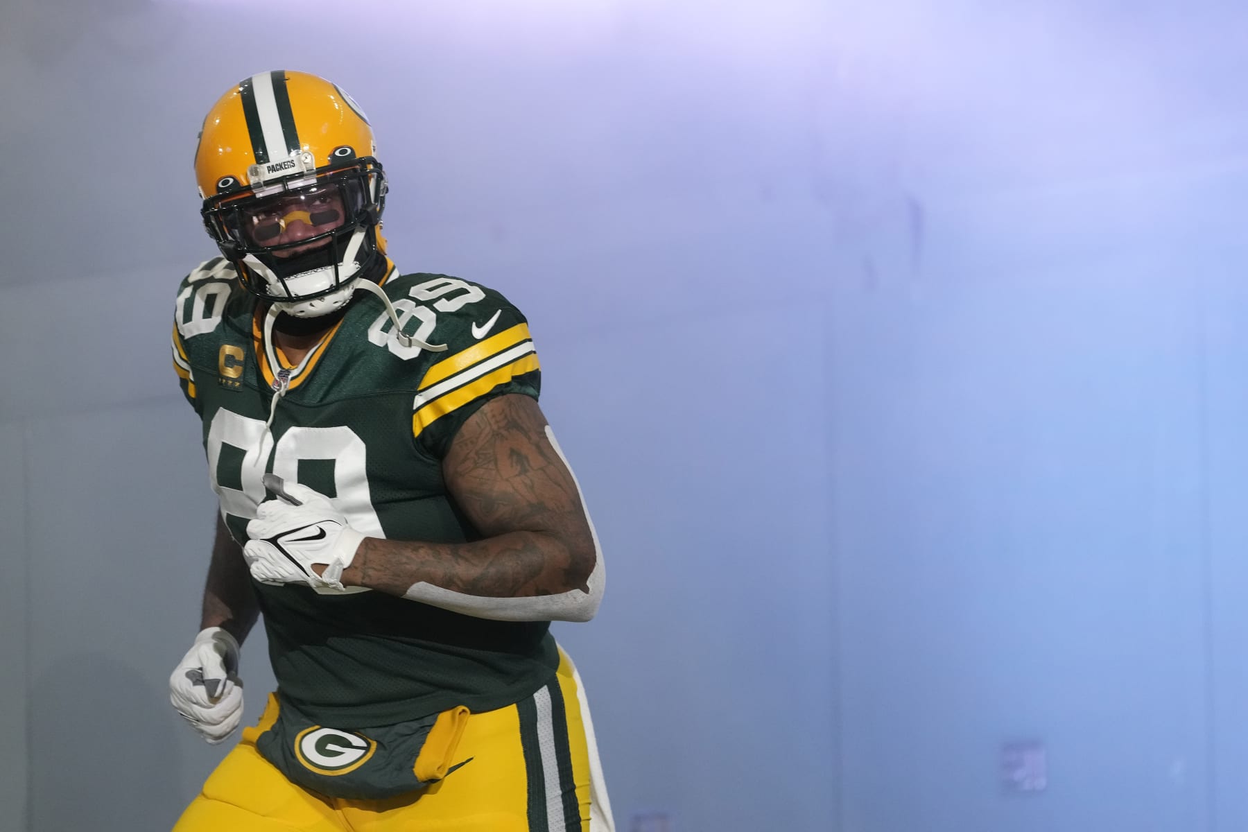 GREEN BAY, WISCONSIN - JANUARY 08: Marcedes Lewis #89 of the Green Bay Packers runs onto the field before a game against the Detroit Lions at Lambeau Field on January 08, 2023 in Green Bay, Wisconsin. (Photo by Patrick McDermott/Getty Images)