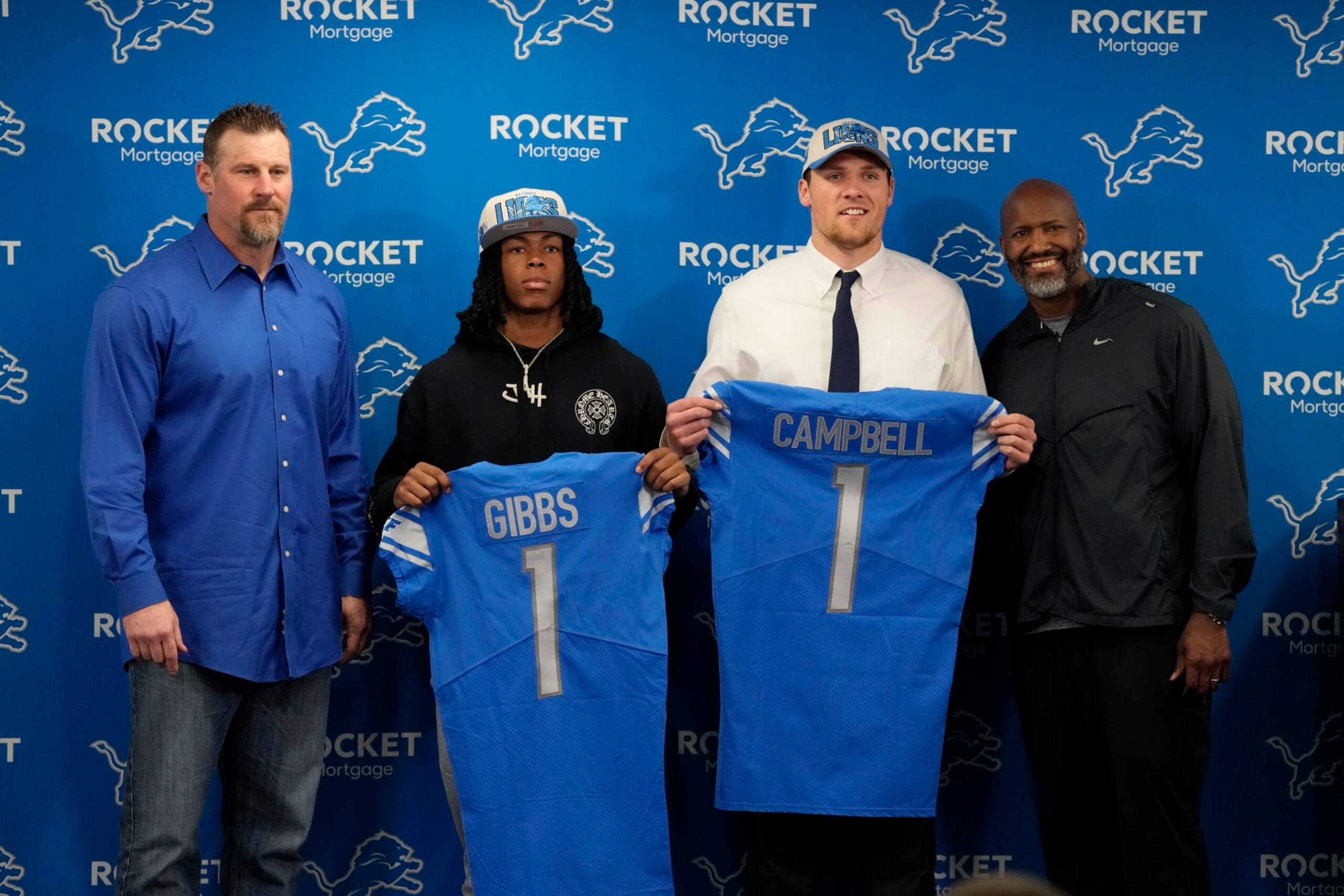 From left to right, Detroit Lions head coach Dan Campbell, No. 12 draft pick Jahmyr Gibbs, No. 18 pick Jack Campbell and general manager Brad Holmes pose during during an NFL football news conference, Friday, April 28, 2023, in Allen Park, Mich. (AP Photo/Carlos Osorio)