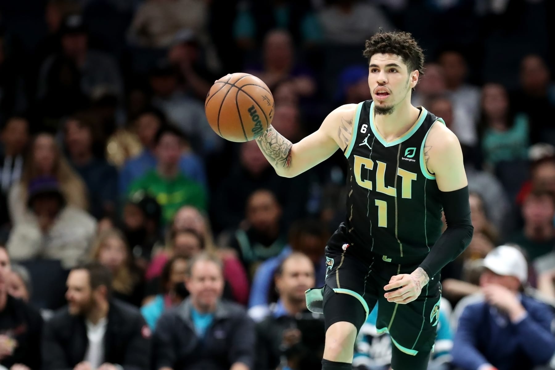 CHARLOTTE, NORTH CAROLINA - FEBRUARY 05: LaMelo Ball #1 of the Charlotte Hornets brings the ball down the court during the first period of a basketball game against the Orlando Magic at Spectrum Center on February 05, 2023 in Charlotte, North Carolina. NOTE TO USER: User expressly acknowledges and agrees that, by downloading and or using this photograph, User is consenting to the terms and conditions of the Getty Images License Agreement. (Photo by David Jensen/Getty Images)