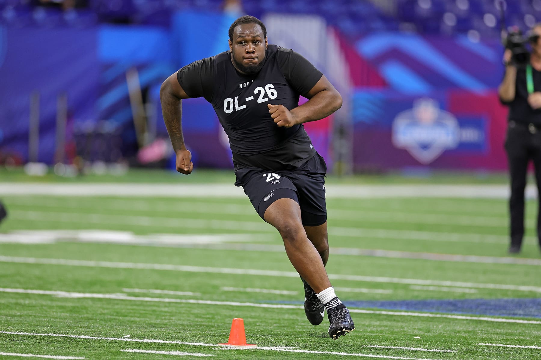 INDIANAPOLIS, INDIANA - MARCH 05: Dawand Jones of Ohio State participates in a drill during the NFL Combine at Lucas Oil Stadium on March 05, 2023 in Indianapolis, Indiana. (Photo by Stacy Revere/Getty Images)
