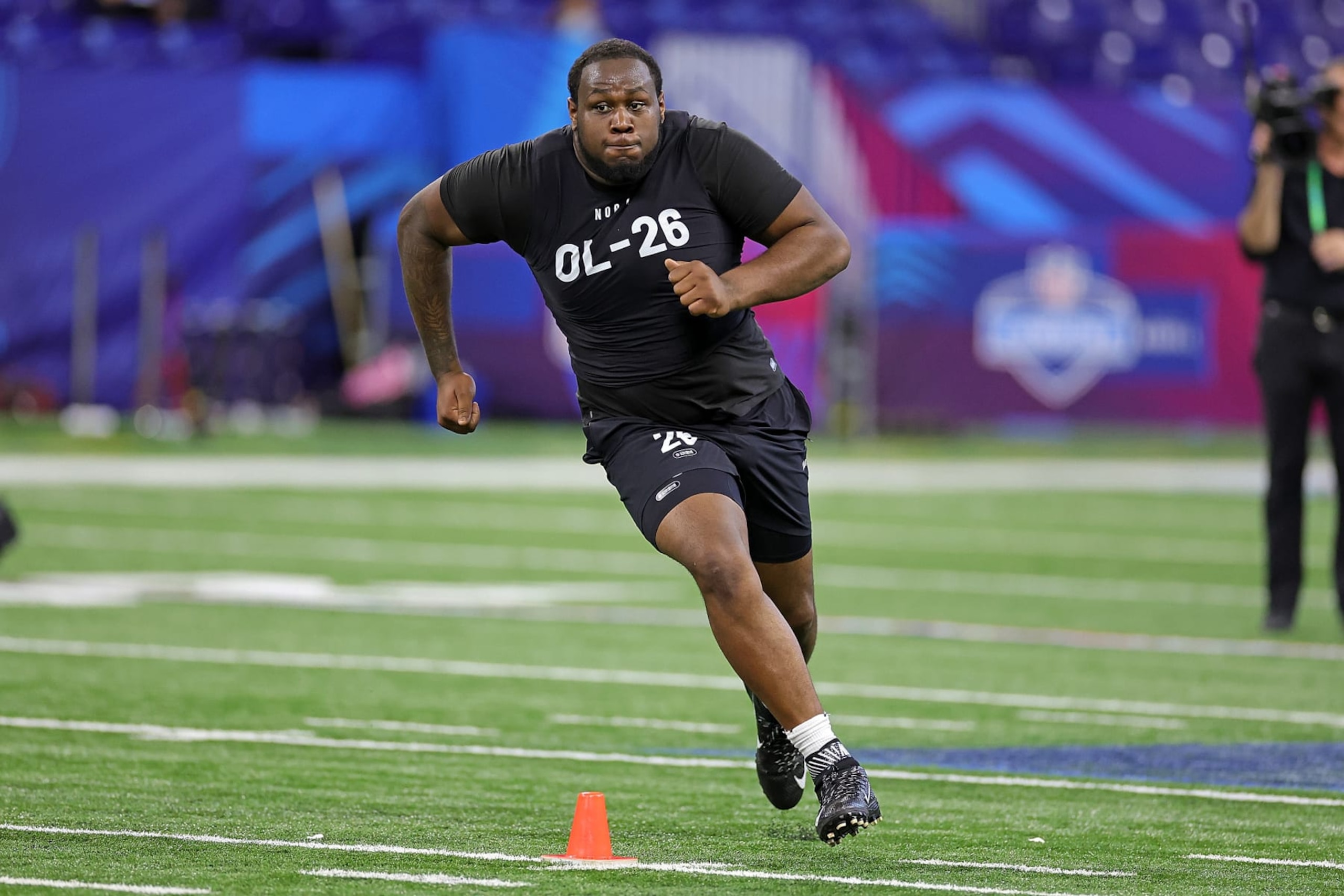 INDIANAPOLIS, INDIANA - MARCH 05: Dawand Jones of Ohio State participates in a drill during the NFL Combine at Lucas Oil Stadium on March 05, 2023 in Indianapolis, Indiana. (Photo by Stacy Revere/Getty Images)