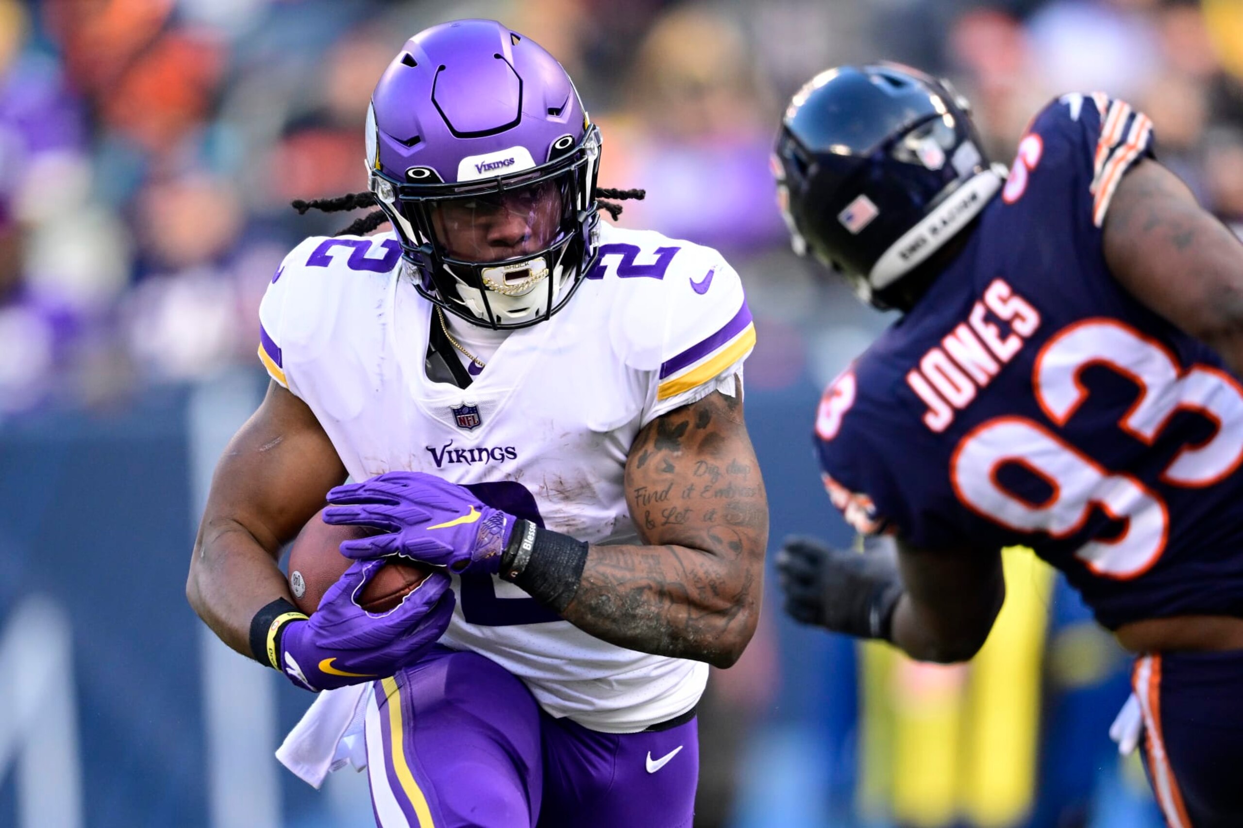 CHICAGO, ILLINOIS - JANUARY 08: Alexander Mattison #2 of the Minnesota Vikings rushes for a touchdown in the second quarter of a game against he Chicago Bears at Soldier Field on January 08, 2023 in Chicago, Illinois. (Photo by Quinn Harris/Getty Images)