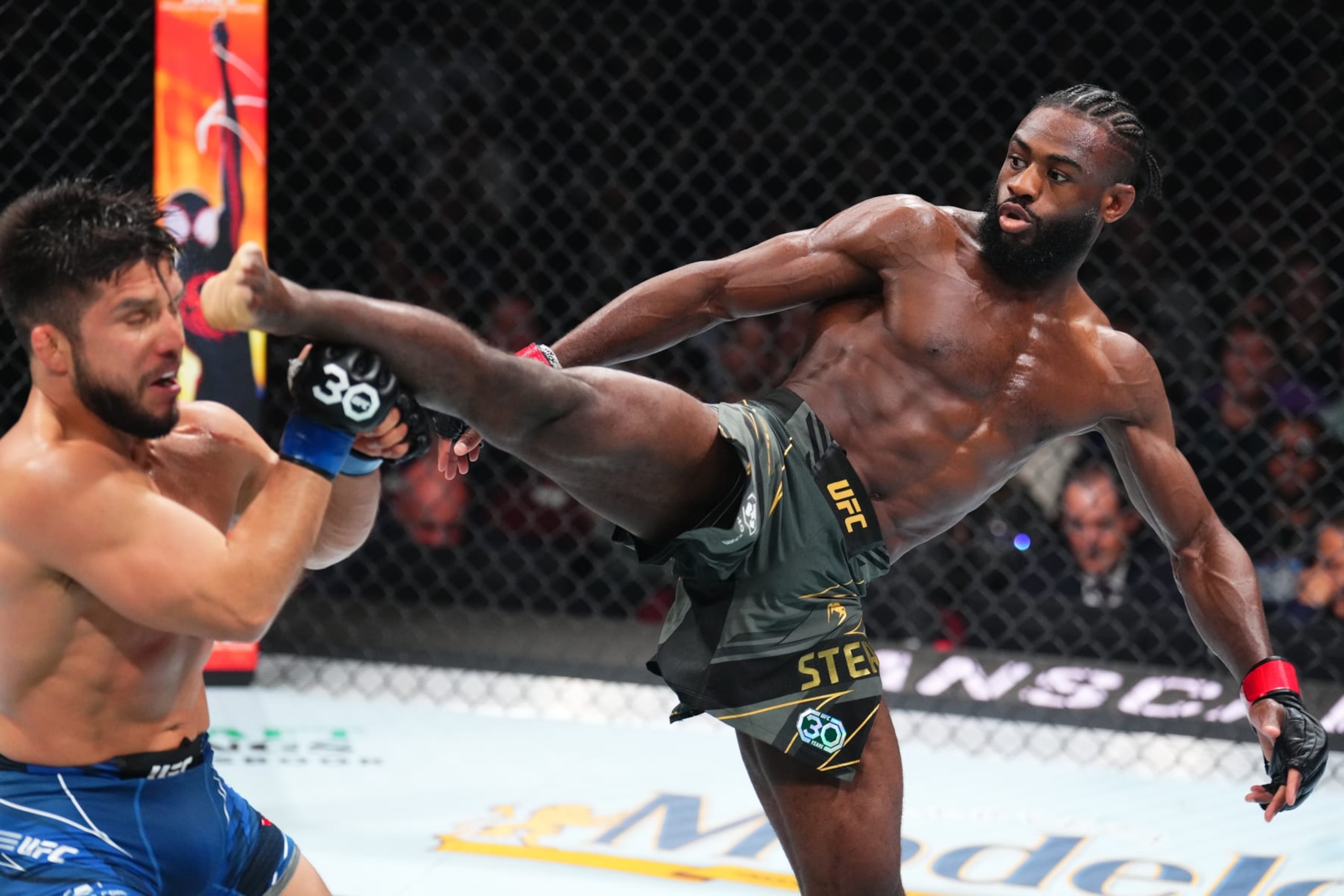 NEWARK, NEW JERSEY - MAY 06: (R-L) Aljamain Sterling kicks Henry Cejudo in the UFC bantamweight championship fight during the UFC 288 event at Prudential Center on May 06, 2023 in Newark, New Jersey. (Photo by Chris Unger/Zuffa LLC via Getty Images)