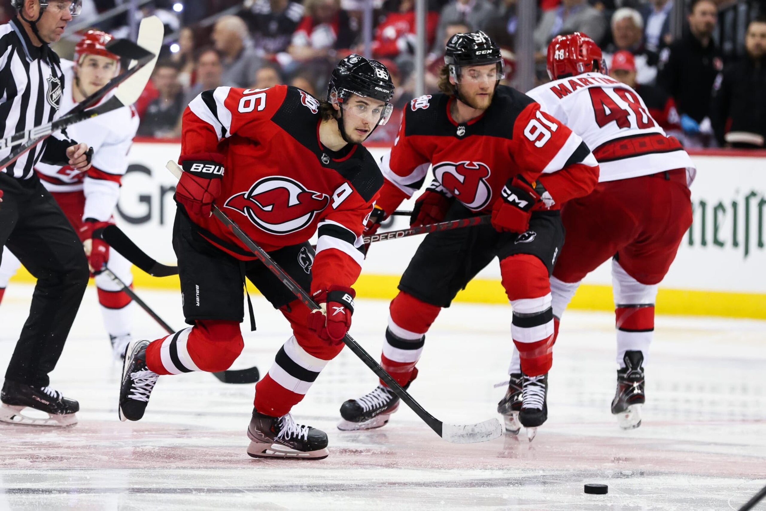 NEWARK, NJ - MAY 07: New Jersey Devils center Jack Hughes (86) passes the puck during Game 3 of an Eastern Conference Second Round playoff game between the Carolina Hurricanes and the New Jersey Devils on May 7, 2023, at Prudential Center in Newark, New Jersey. (Photo by Andrew Mordzynski/Icon Sportswire via Getty Images)