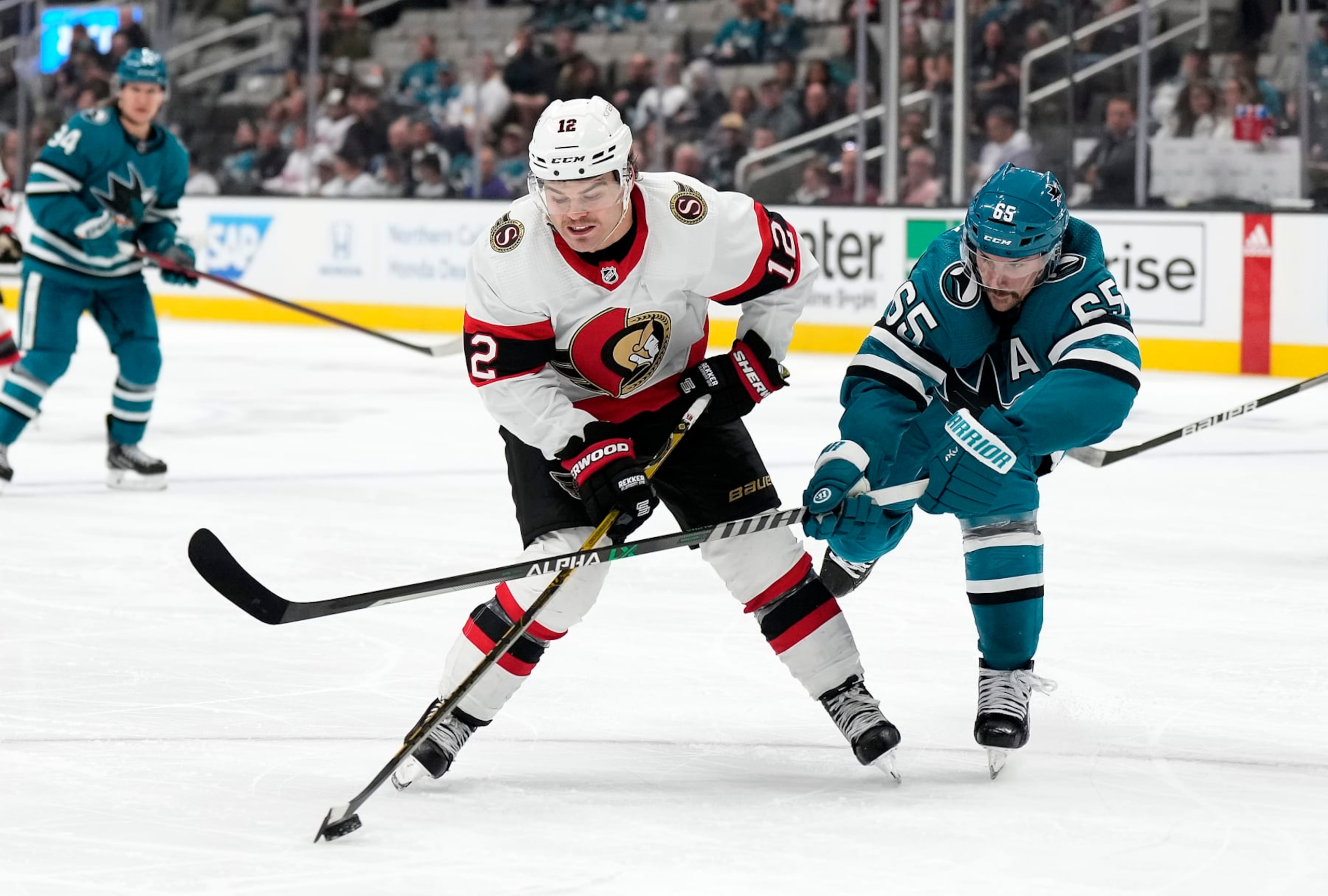 Ottawa Senators winger Alex DeBrincat (left) and San Jose Sharks defenseman Erik Karlsson. 