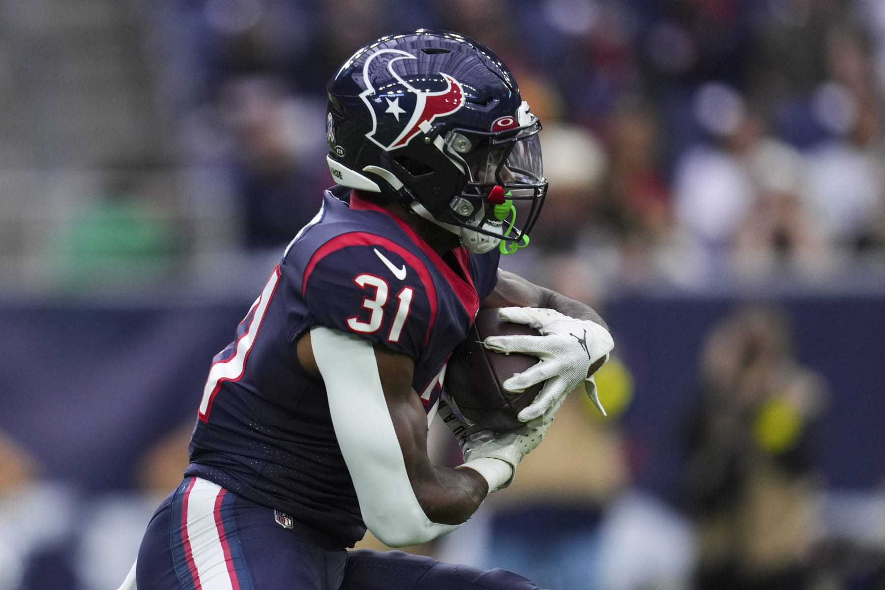 HOUSTON, TX - NOVEMBER 20: Dameon Pierce #31 of the Houston Texans runs the ball against the Washington Commanders at NRG Stadium on November 20, 2022 in Houston, Texas. (Photo by Cooper Neill/Getty Images)