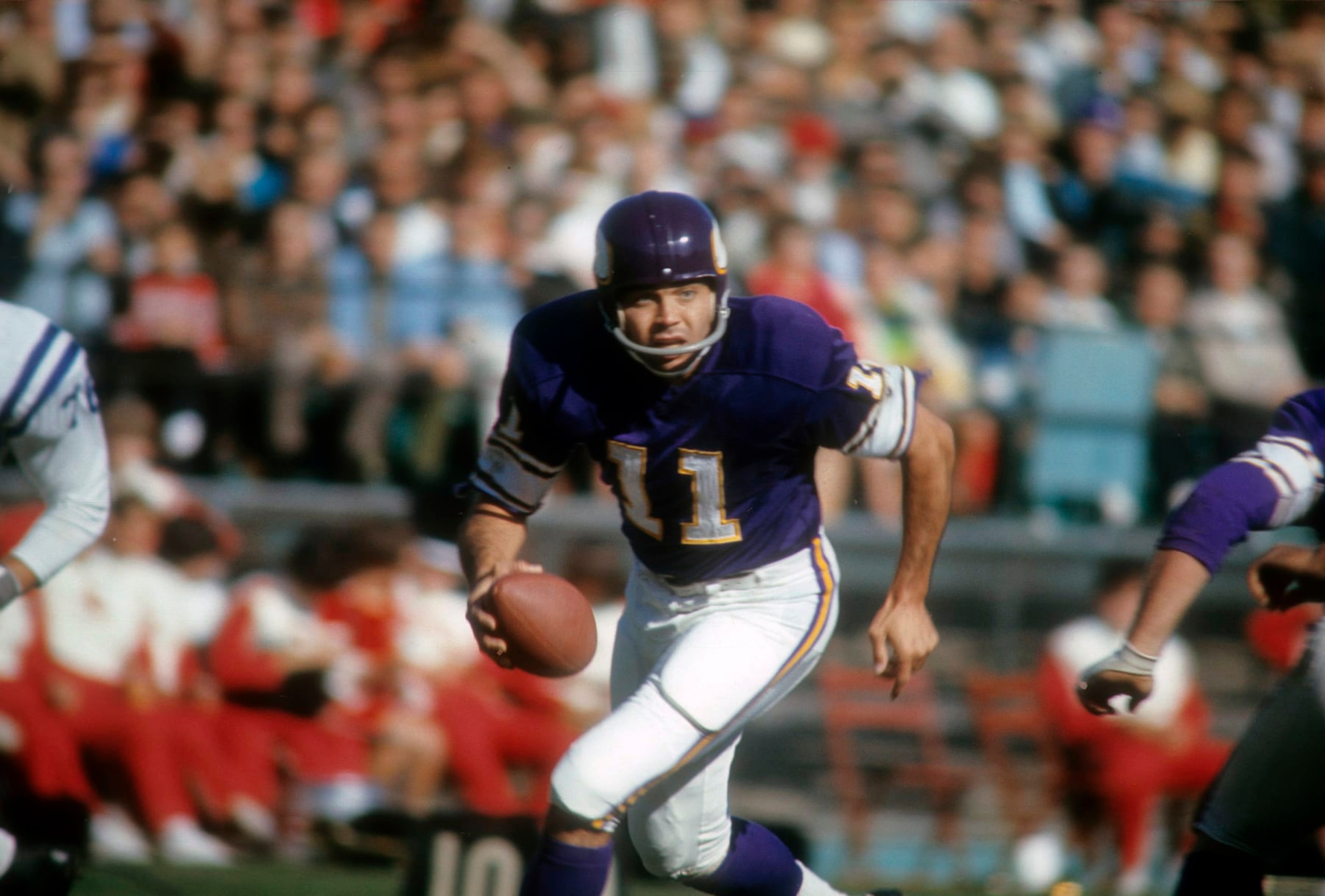 MINNEAPOLIS, MN - OCTOBER 22: Quarterback Joe Kapp #11 of the Minnesota Vikings runs with the ball against the Baltimore Colts during an NFL football game at Metropolitan Stadium October 22, 1967 in Minneapolis, Minnesota. Kapp played for the Vikings from 1967-69. (Photo by Focus on Sport/Getty Images)