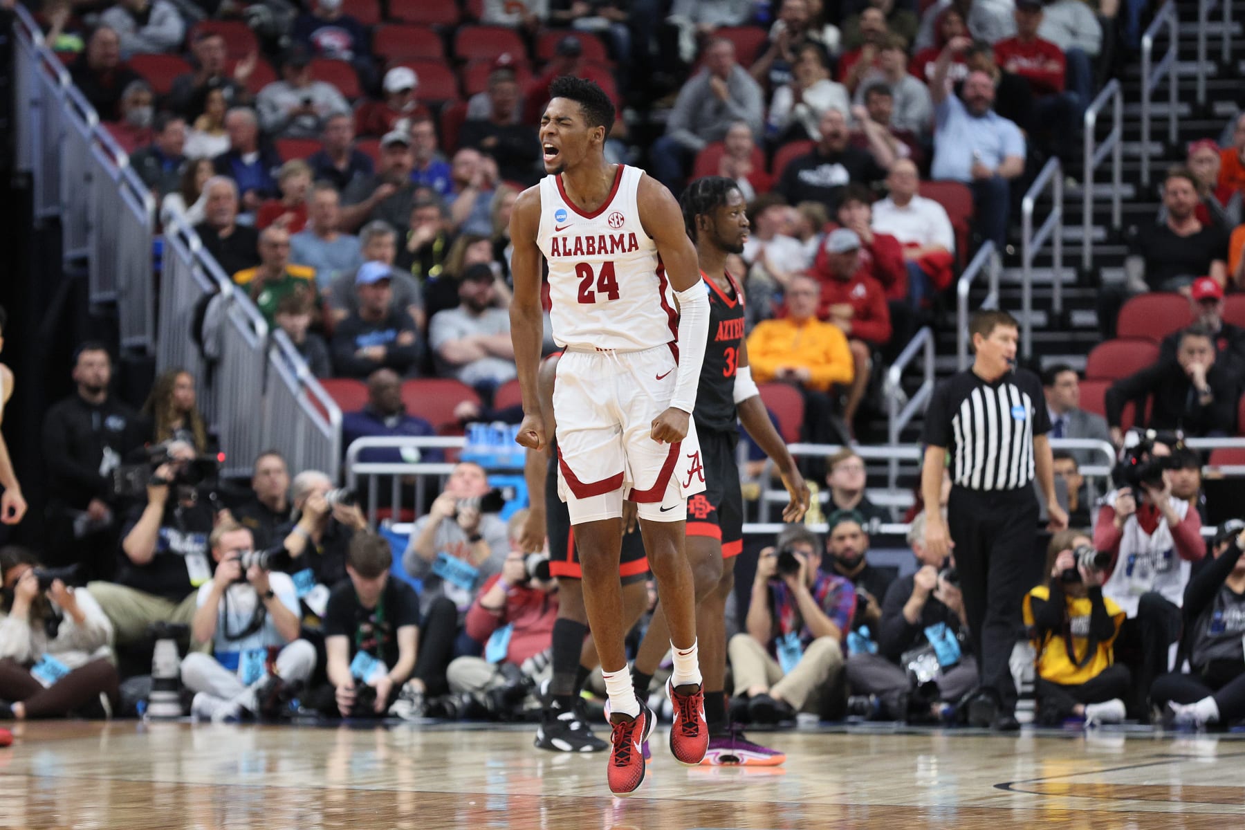 LOUISVILLE, KENTUCKY - MARCH 24: Brandon Miller #24 of the Alabama Crimson Tide reacts during the first half in the Sweet 16 round of the NCAA Men's Basketball Tournament at KFC YUM! Center against the San Diego State Aztecs on March 24, 2023 in Louisville, Kentucky. (Photo by Andy Lyons/Getty Images)