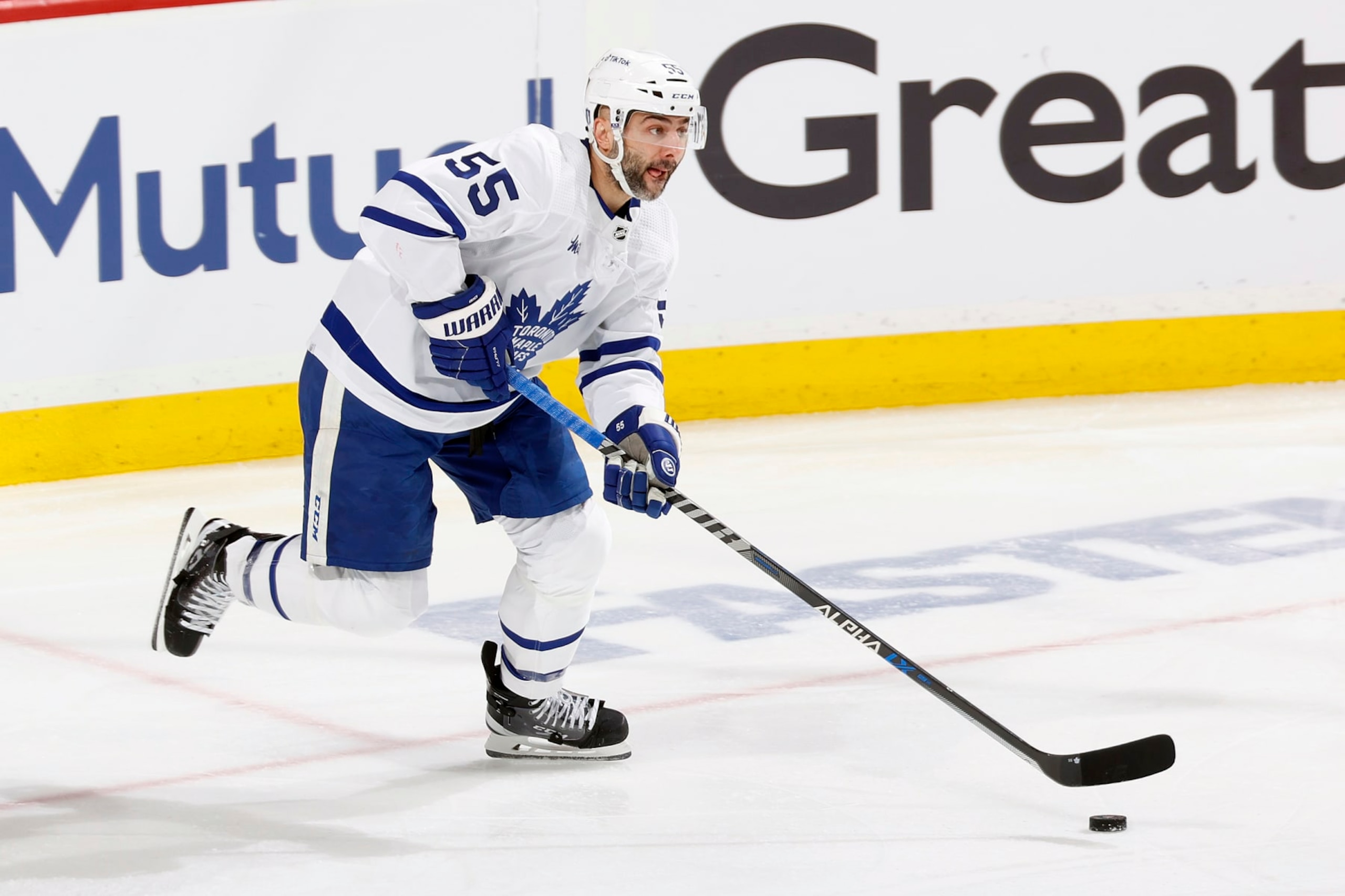 SUNRISE, FL - MAY 7: Mark Giordano #55 of the Toronto Maple Leafs skates with the puck against  the Florida Panthers in Game Three of the Second Round of the 2023 Stanley Cup Playoffs at the FLA Live Arena on May 7, 2023 in Sunrise, Florida. The Panthers defeated the Maple Leafs 3-2 in overtime. (Photo by Joel Auerbach/Getty Images)