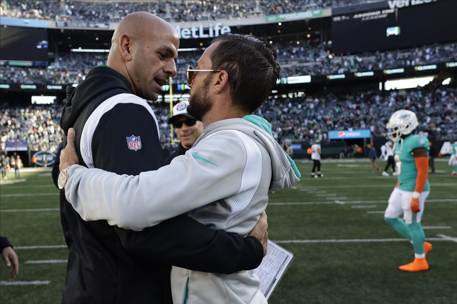 New York Jets head coach Robert Saleh, left, greets Miami Dolphins head coach Mike McDaniel after an NFL football game, Sunday, Oct. 9, 2022, in East Rutherford, N.J. (AP Photo/Adam Hunger)