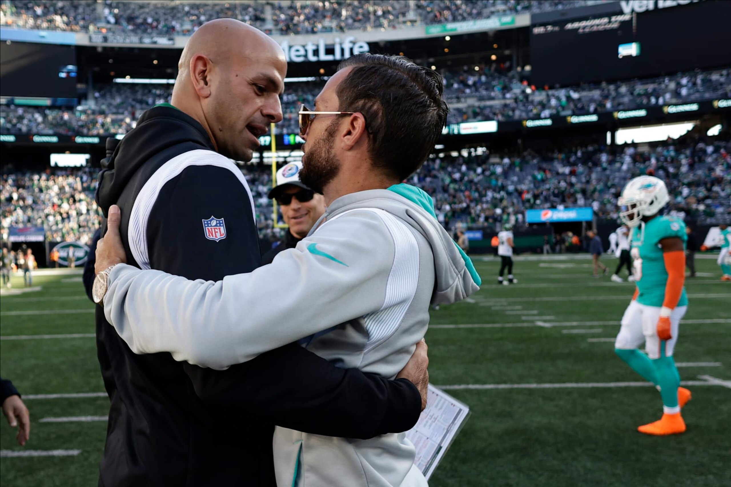 New York Jets head coach Robert Saleh, left, greets Miami Dolphins head coach Mike McDaniel after an NFL football game, Sunday, Oct. 9, 2022, in East Rutherford, N.J. (AP Photo/Adam Hunger)