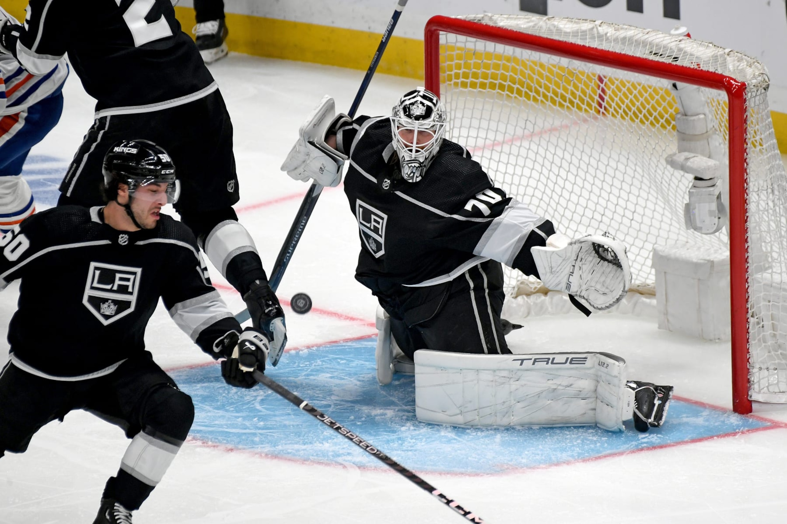 LOS ANGELES, CA - APRIL 23: Los Angeles Kings Goalie Joonas Korpisalo (70) makes a save as Los Angeles Kings Defenceman Sean Durzi (50) looks on during a NHL First Round Western Conference Playoff game between the Edmonton Oilers and the Los Angeles Kings on April 23rd, 2023, at the Crypto.com Arena in Los Angeles, CA. (Photo by Rob Curtis/Icon Sportswire via Getty Images)