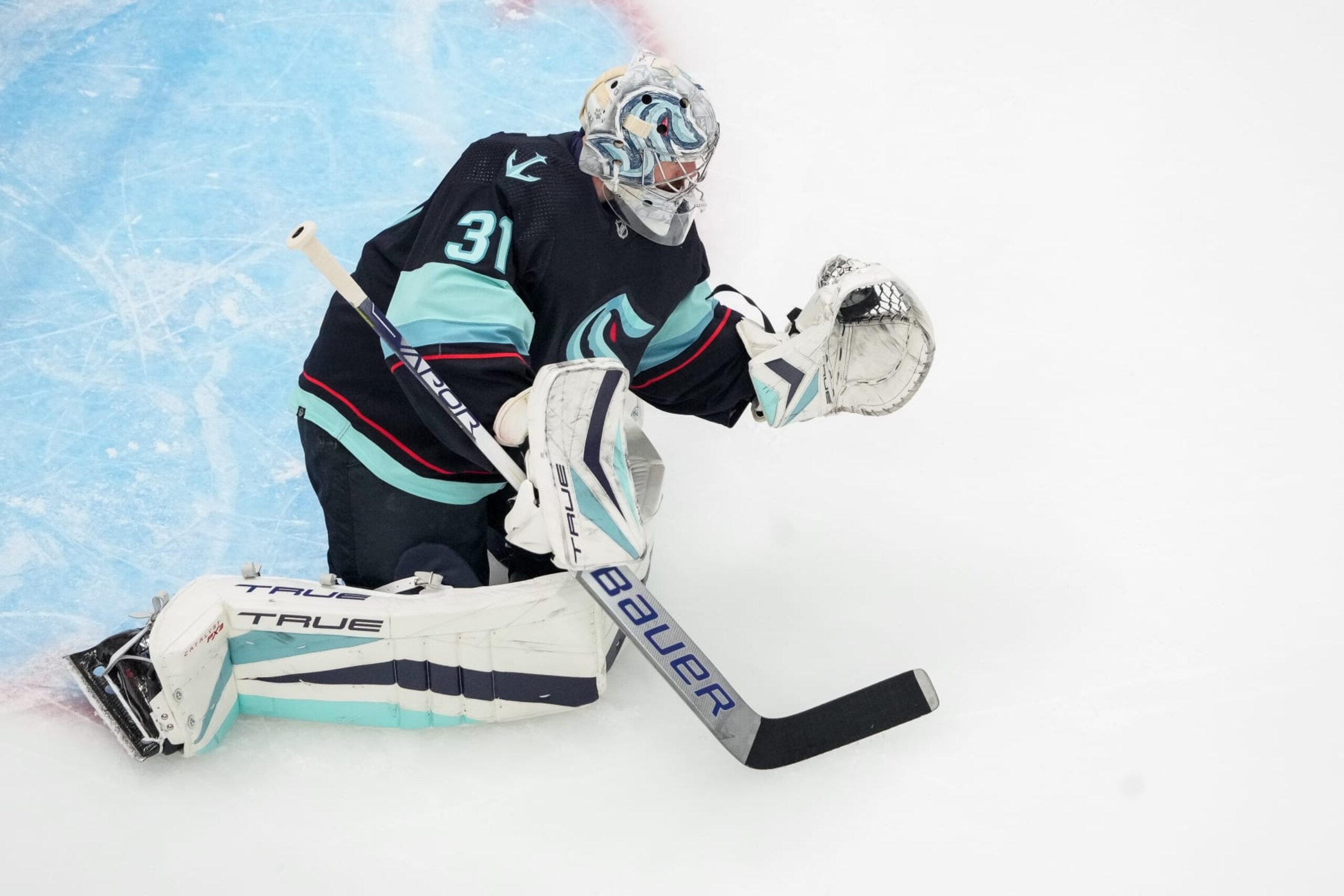 SEATTLE, WASHINGTON - MAY 7: Philipp Grubauer #31 of the Seattle Kraken catches a puck during warm ups before Game Three against the Dallas Stars in the Second Round of the 2023 Stanley Cup Playoffs at Climate Pledge Arena on May 7, 2023 in Seattle, Washington. (Photo by Christopher Mast/NHLI via Getty Images)