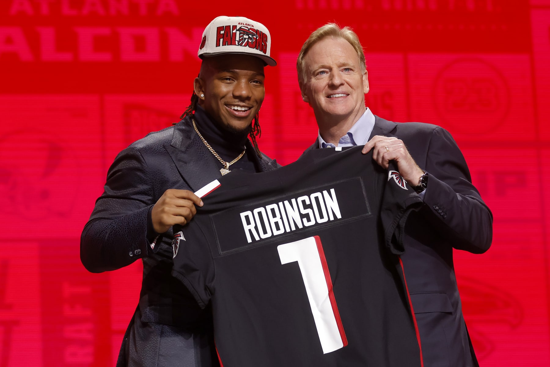 KANSAS CITY, MISSOURI - APRIL 27: (L-R) Bijan Robinson poses with NFL Commissioner Roger Goodell after being selected eighth overall by the Atlanta Falcons during the first round of the 2023 NFL Draft at Union Station on April 27, 2023 in Kansas City, Missouri. (Photo by David Eulitt/Getty Images)